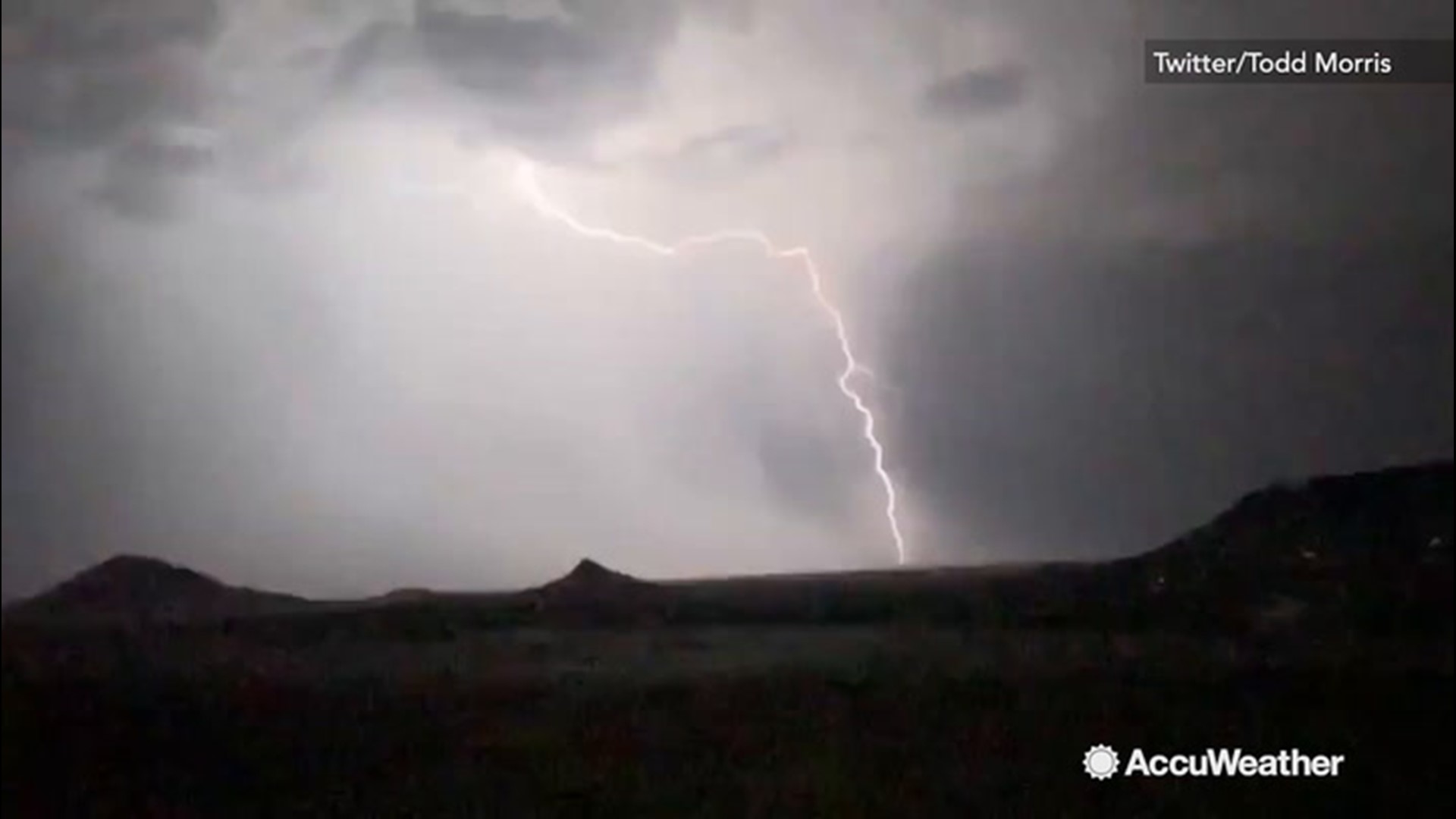 Bolts of lightning leap from the clouds during nighttime thunderstorm |  