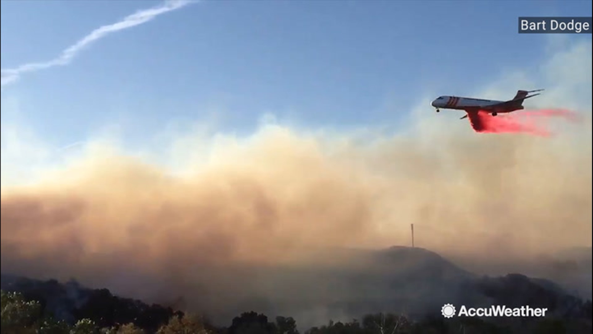 Planes are seen dropping retardant on the Easy Fire in Simi Valley, California, on Oct. 30.