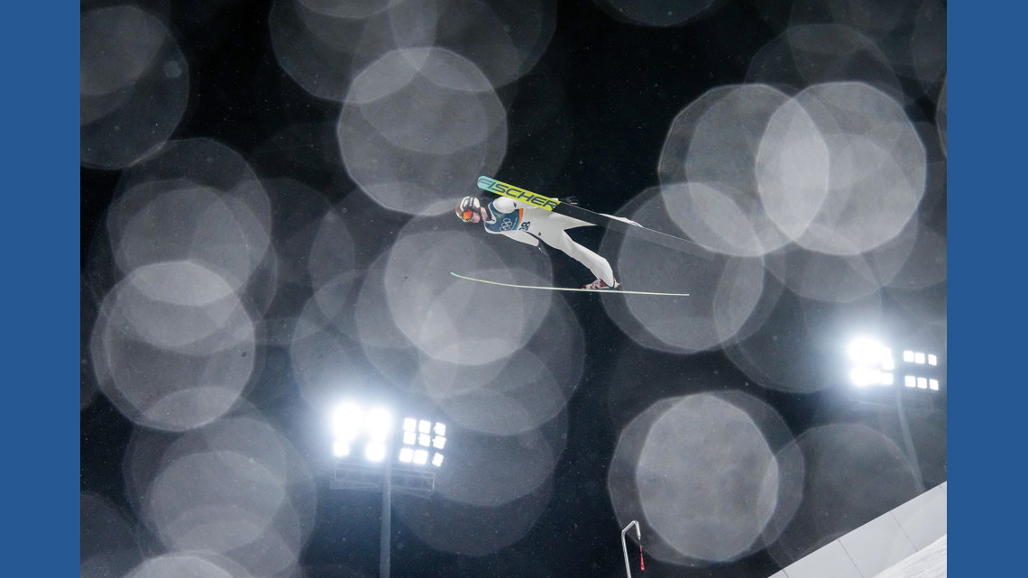 One Extraordinary Photo: Ski jumper glides through rain