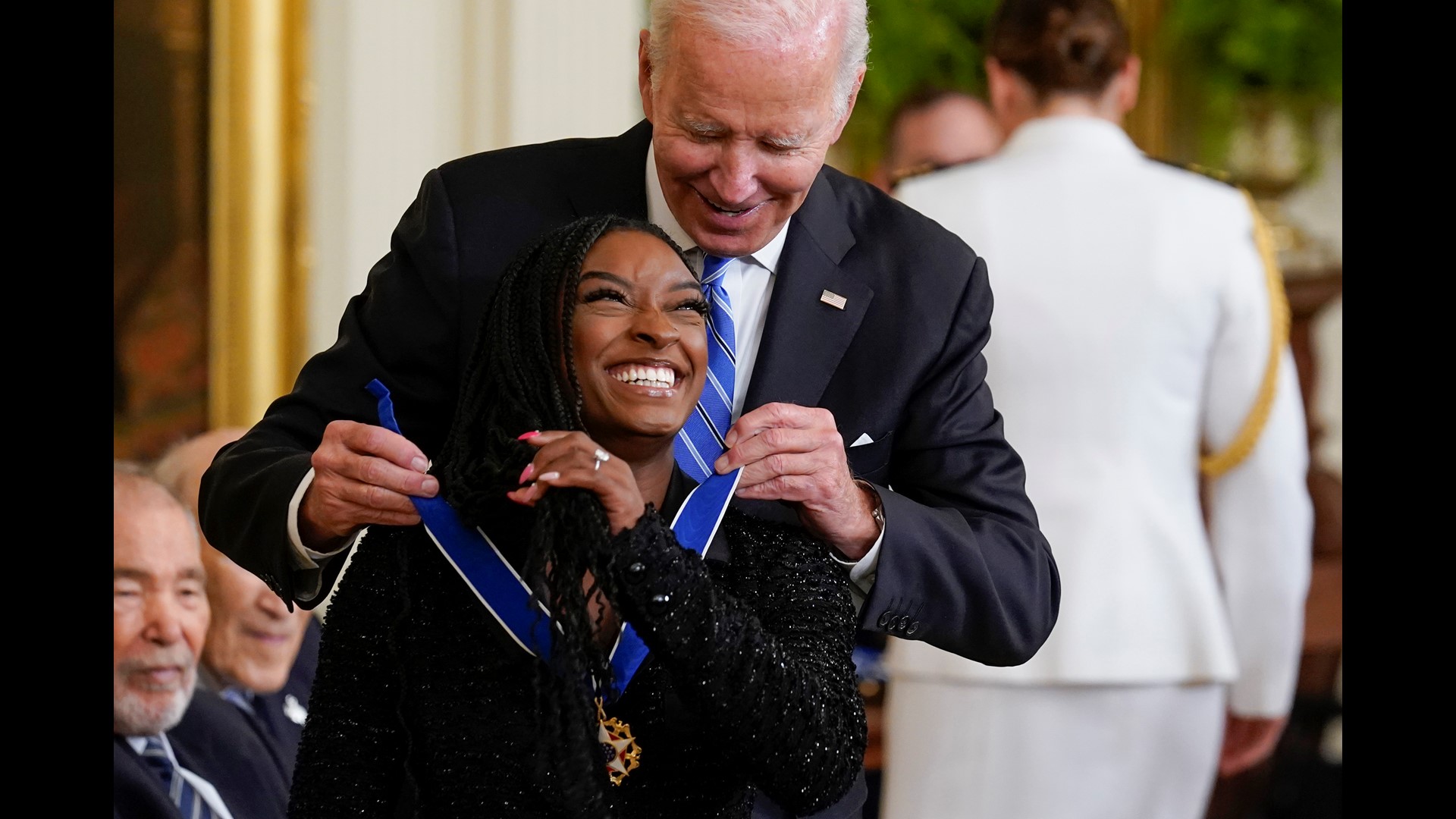 President Biden awards the Medal of Freedom to 17 people, including Simone Biles, Gabrielle Giffords and Fred Gray.
