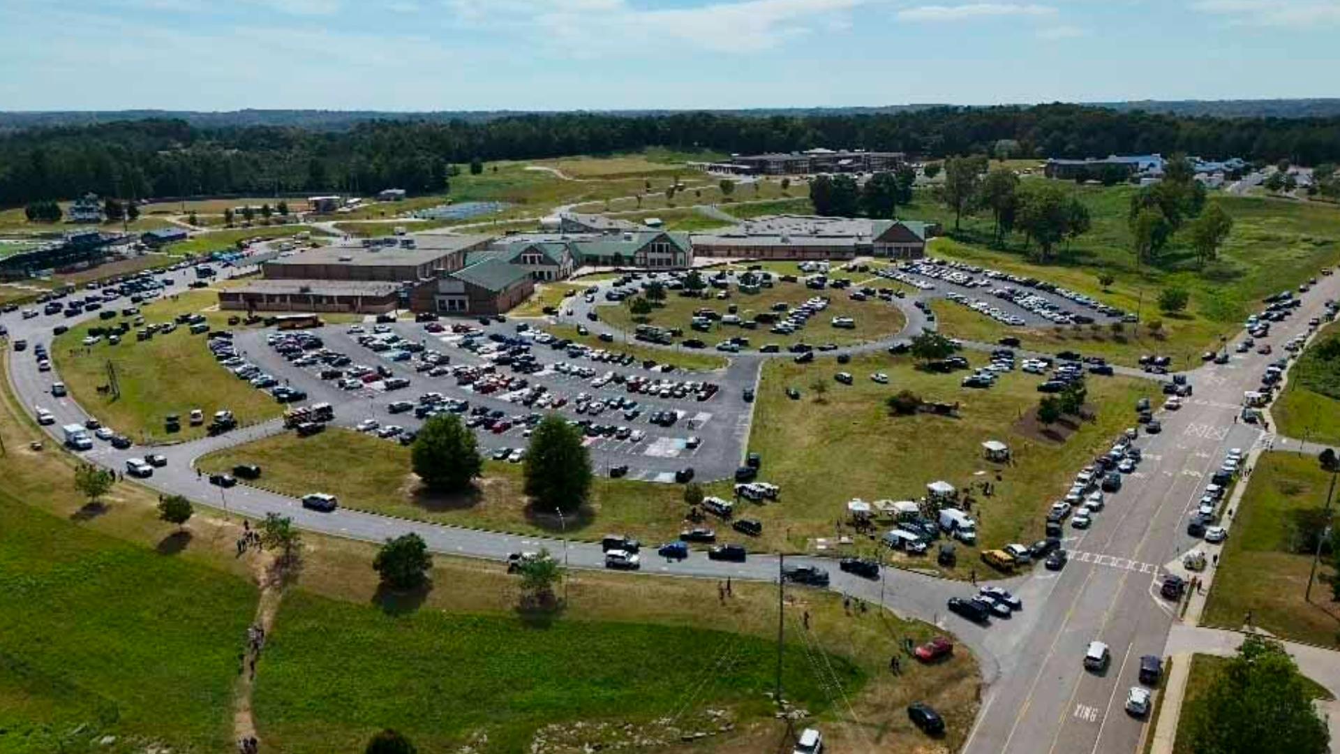 Four people are dead and several others are injured after a 14-year-old opened fire at a high school about an hour outside of Atlanta.