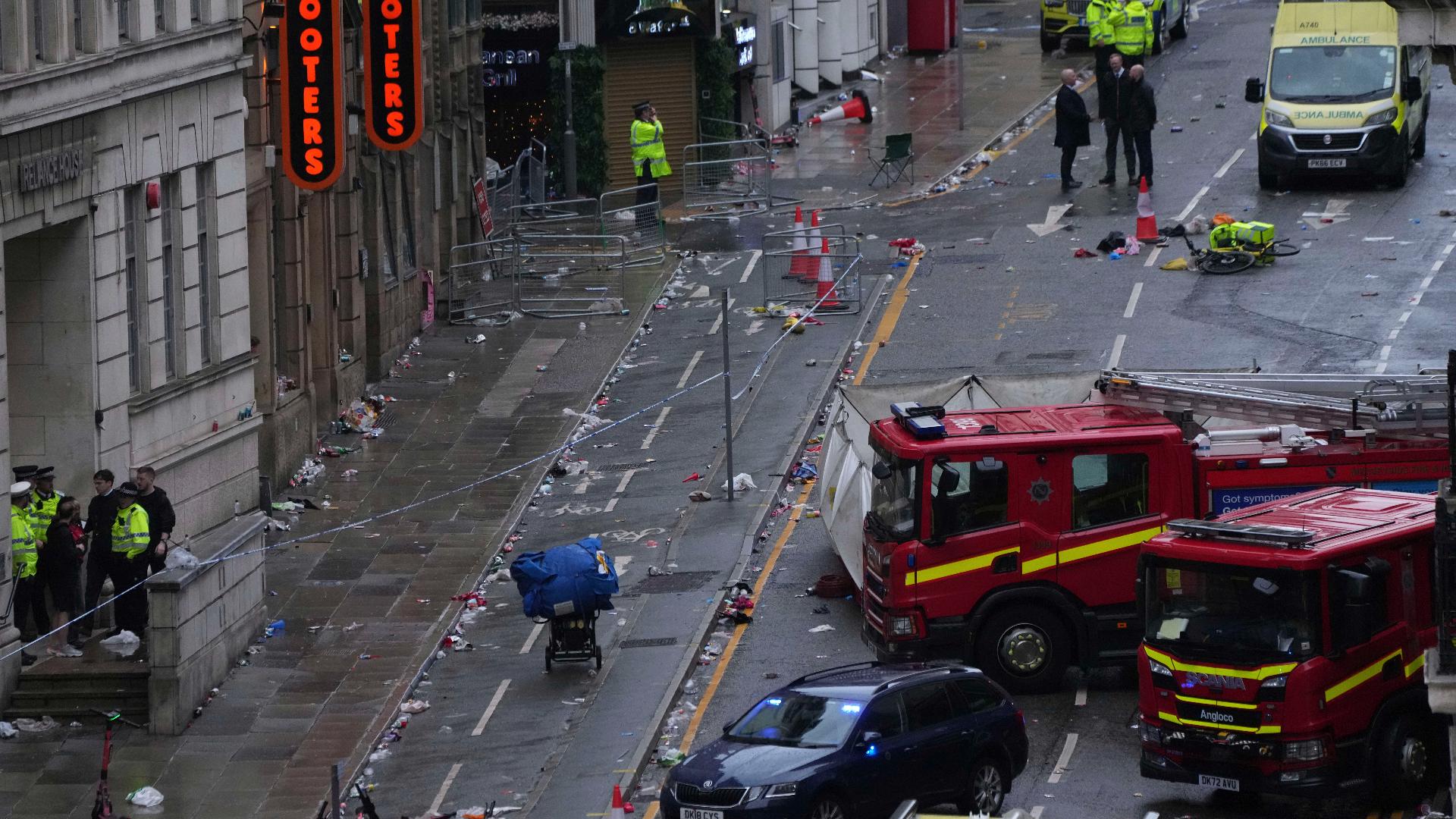 Investigators in England are looking into why a driver plowed into a crowd in Liverpool as soccer fans were celebrating a championship win.