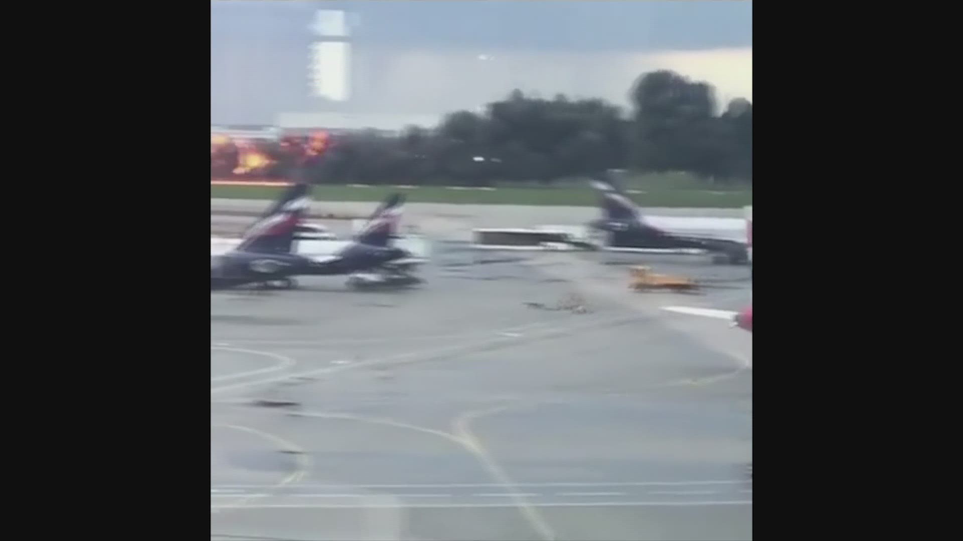 Russian officials say one person died and at least four were injured after a plane belonging to flagship carrier Aeroflot made an emergency landing in Moscow with flames and smoke billowing from its rear section. (AP)