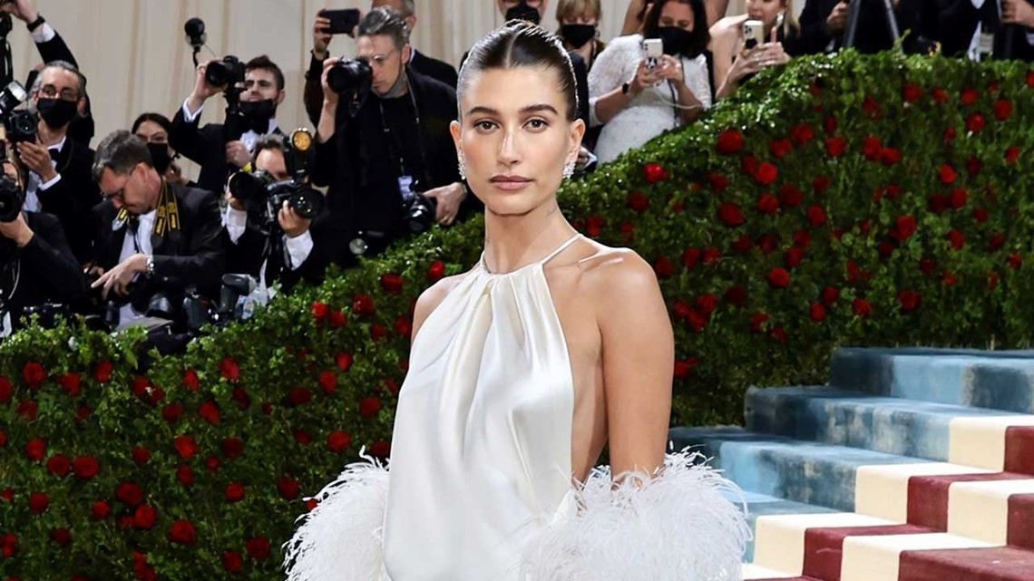 hailey bieber red carpet dress Hailey Bieber Matches Justin in a Black Dress With a Twist at the 2026 Grammys