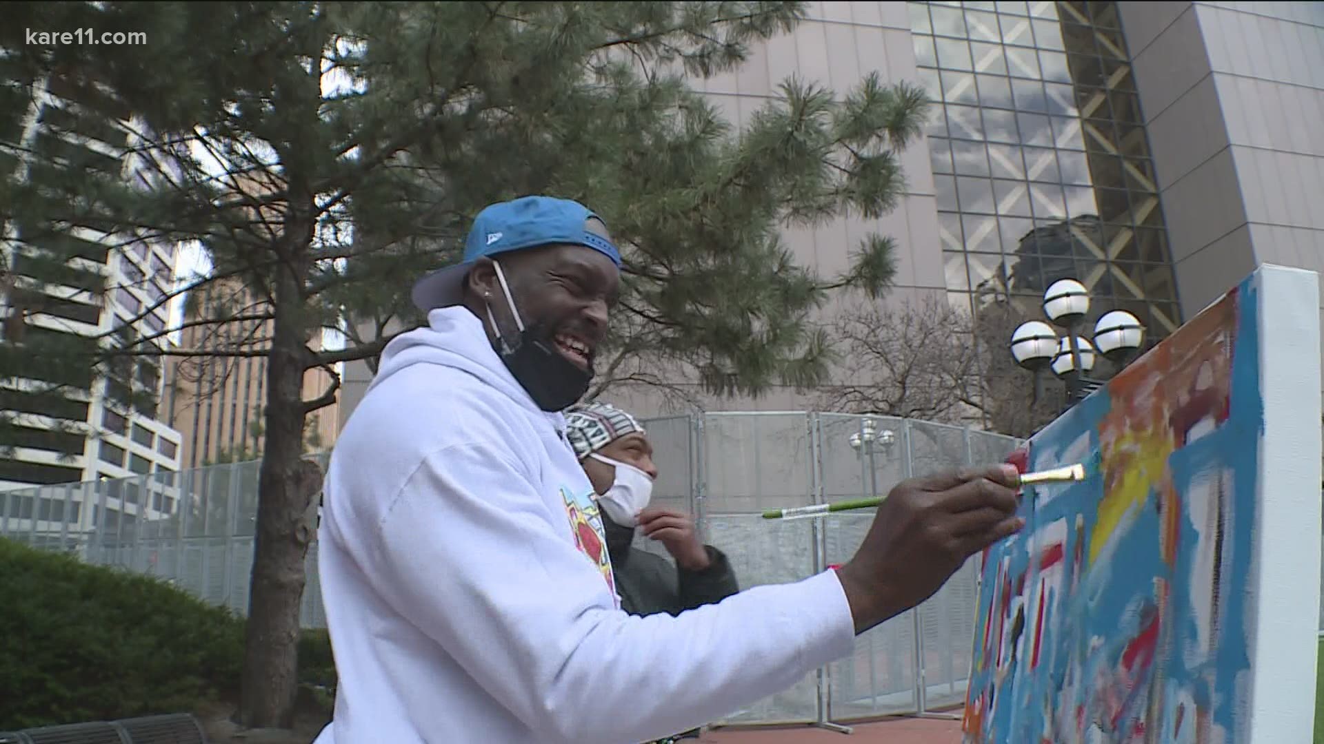Black artist, Sean Garrison, painted a piece of art outside the courthouse during Tuesday's Derek Chauvin verdict.