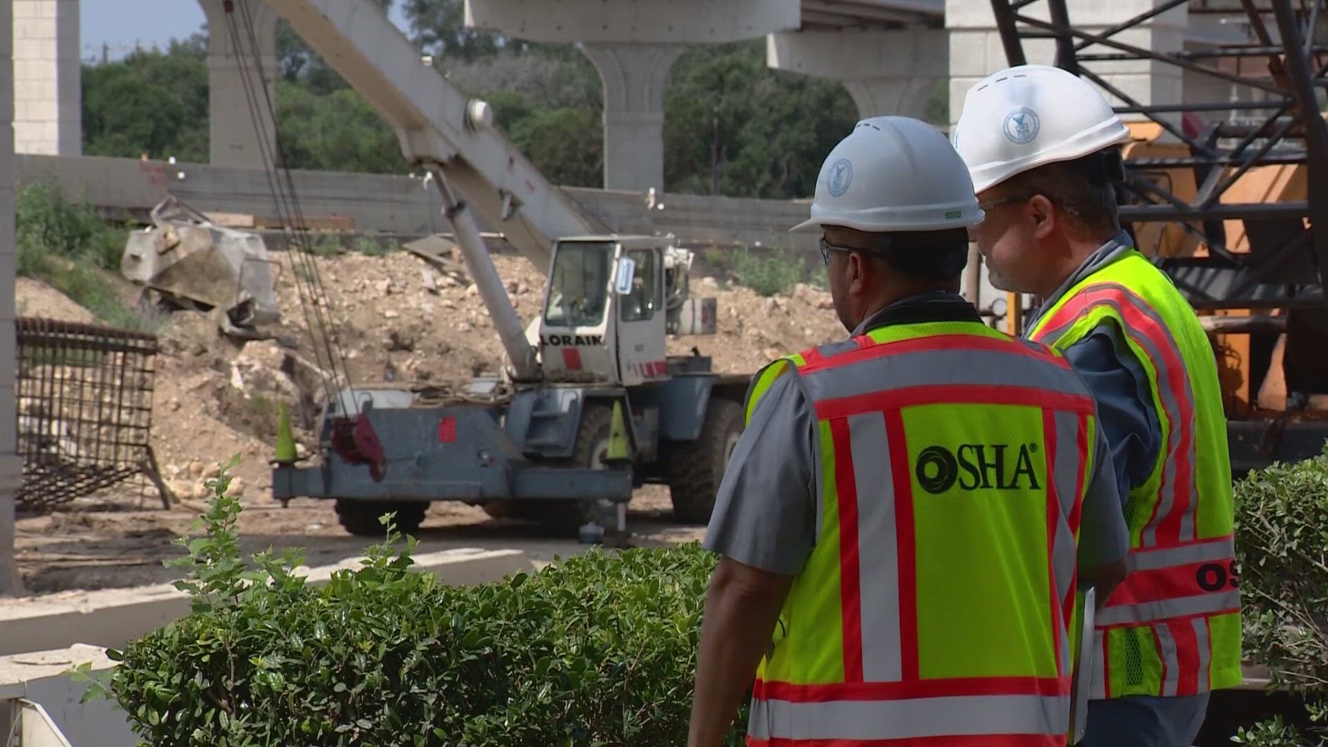 Two construction workers are in the hospital after the cherry picker bucket they were in went crashing to the ground.