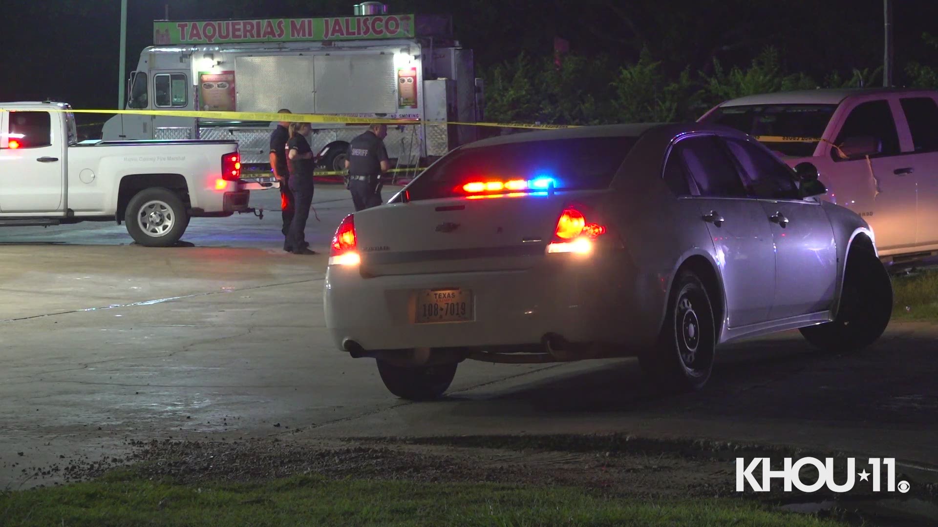 Two children and two adults were burned after someone fired shots into their vehicle, causing fireworks inside of it to go off, according to the Harris County Fire Marshal's Office.