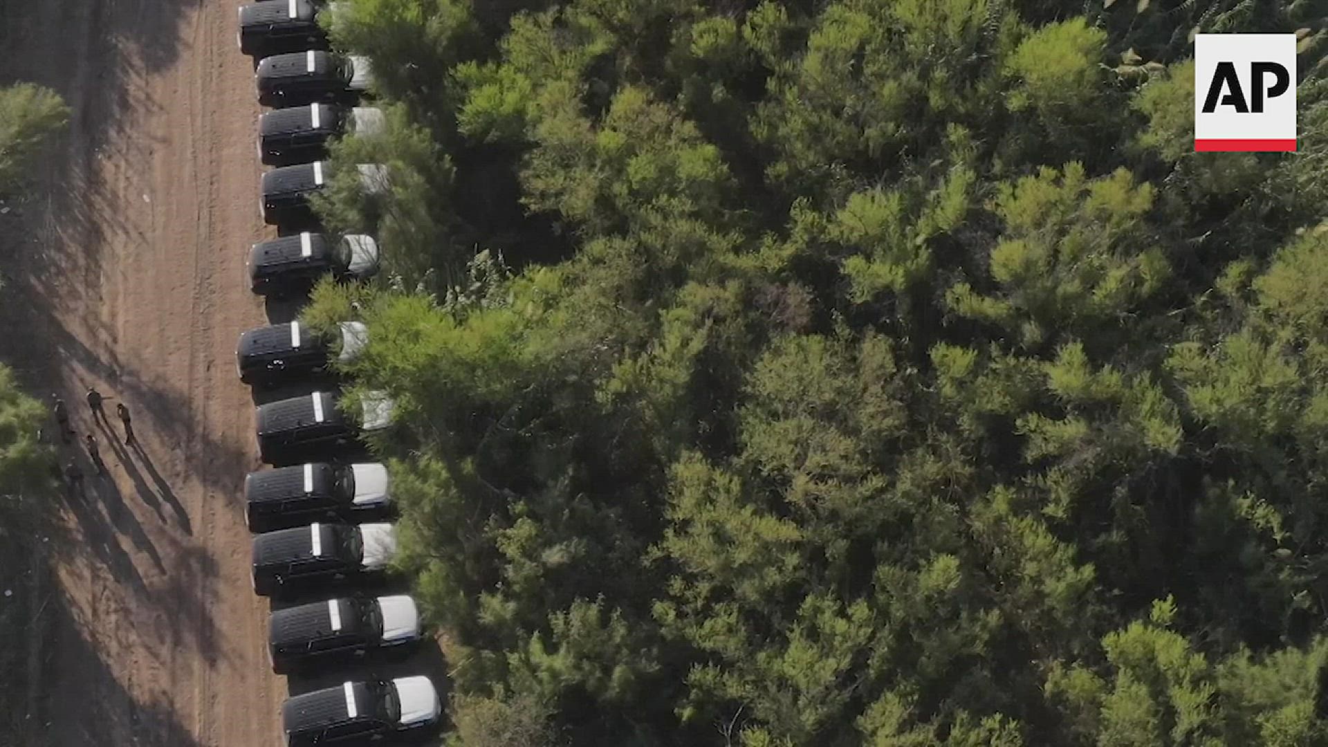 DPS State Troopers have created a miles-long “steel wall” of patrol vehicles to discourage more people from crossing the Rio Grande into an encampment.