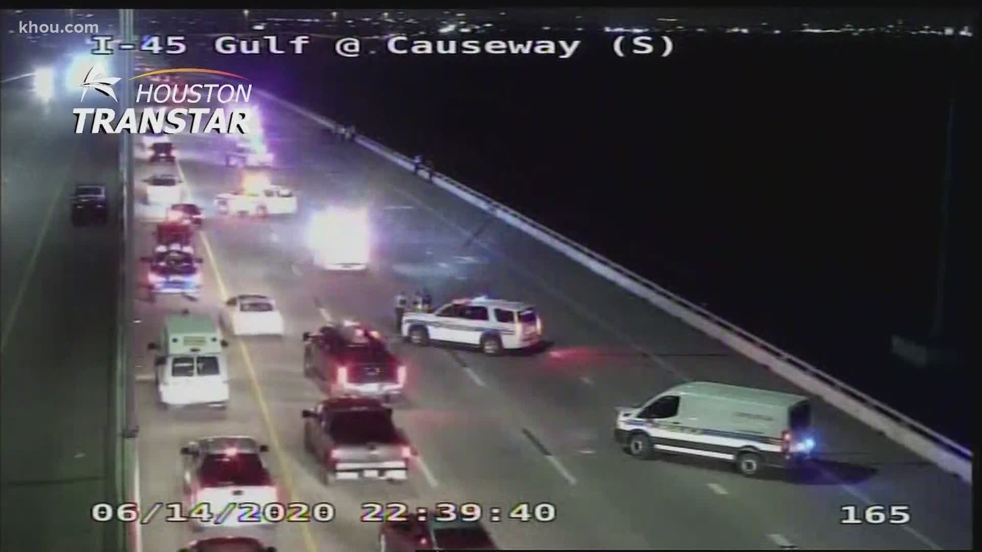 Two men hospitalized with critical injuries as crews continued searching into the night for a third man who was thrown into the water under the Galveston Causeway.