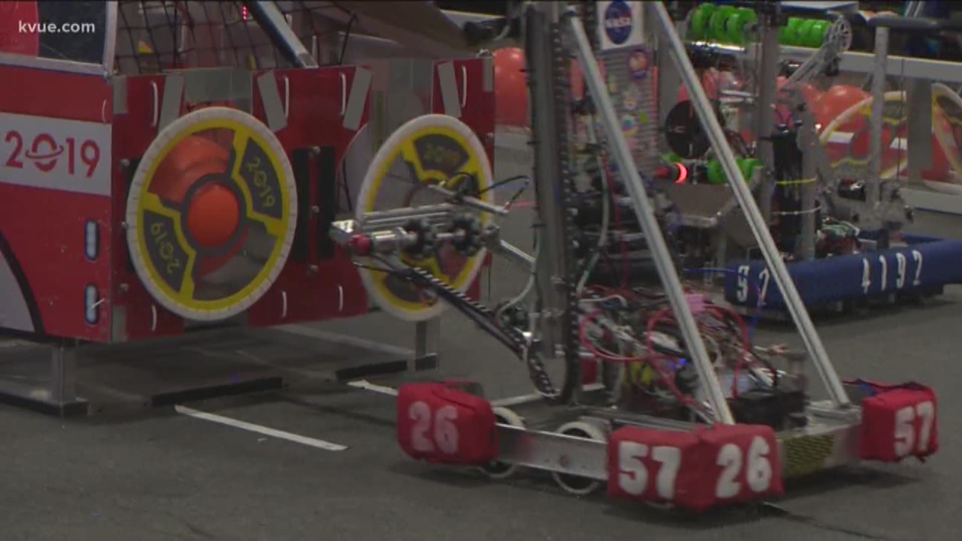 Two local high school robotics teams were competing Friday. Photojournalist Tom Rapp checked out how their robots stacked up against the competition.