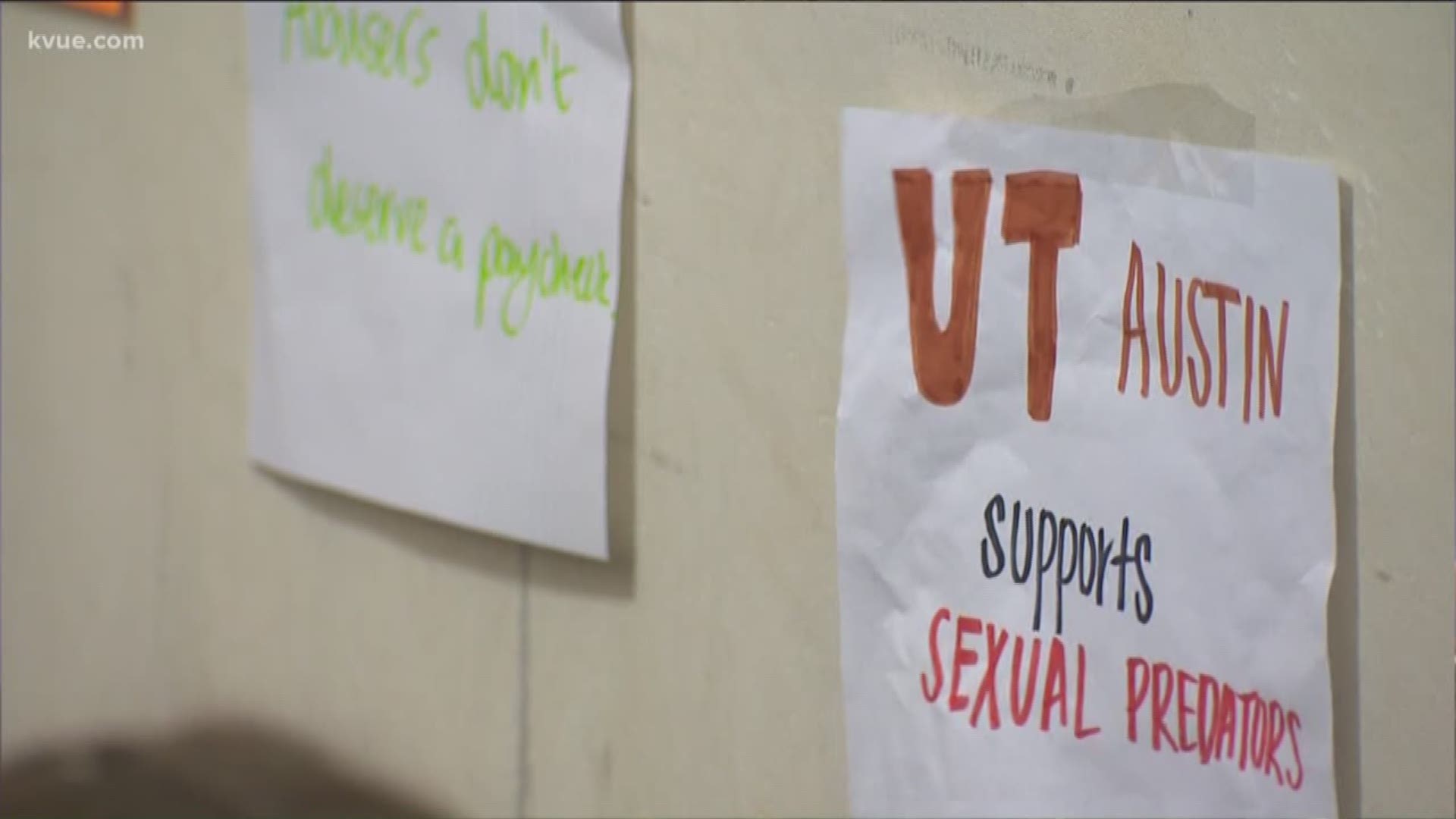 Groups of students posted signs outside administrative offices at the UT Tower on Friday as part of a sit-in protest.
