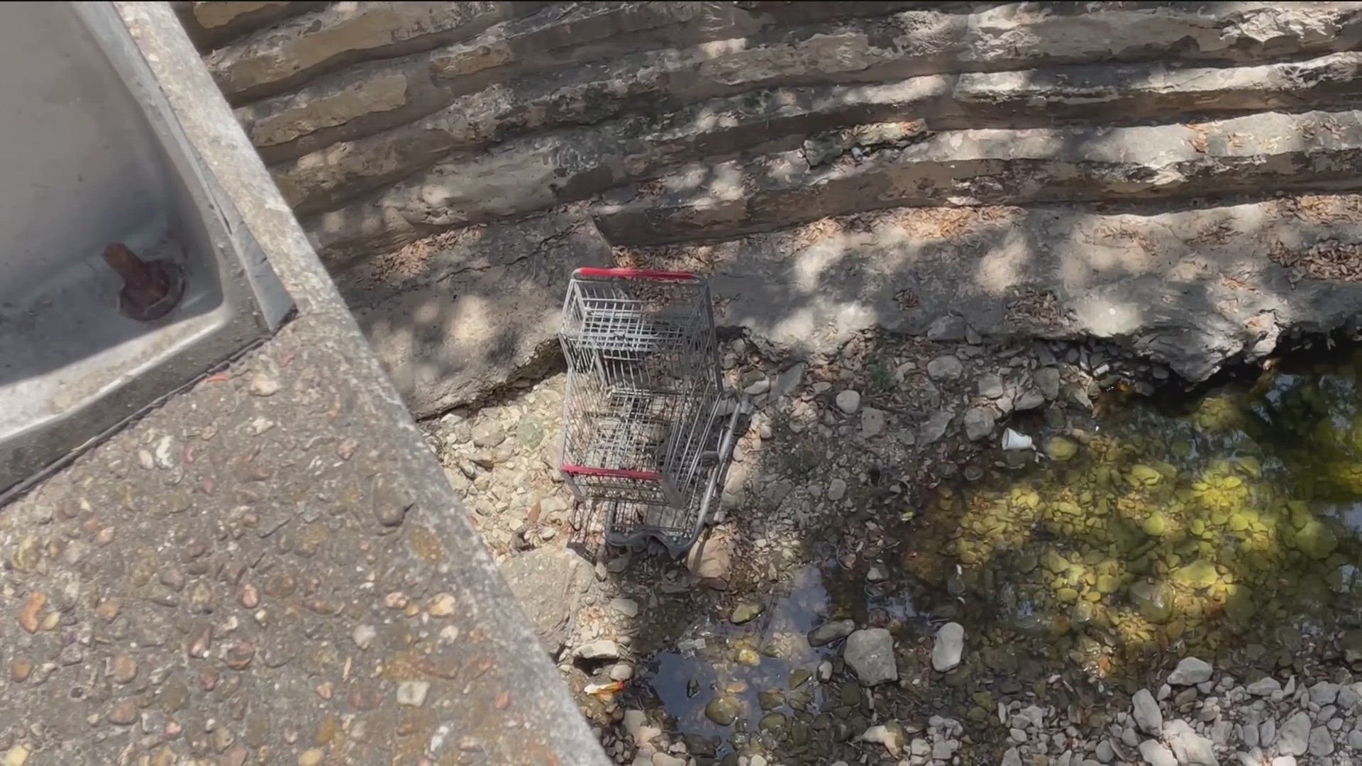 Shopping carts are among some of the items clogging and dirtying up the 11-mile creek.