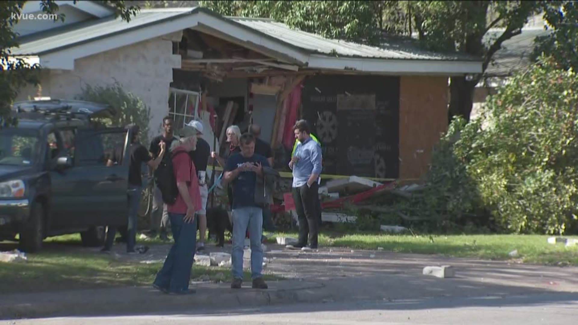 The bus crashed into a house in North Austin on Monday.