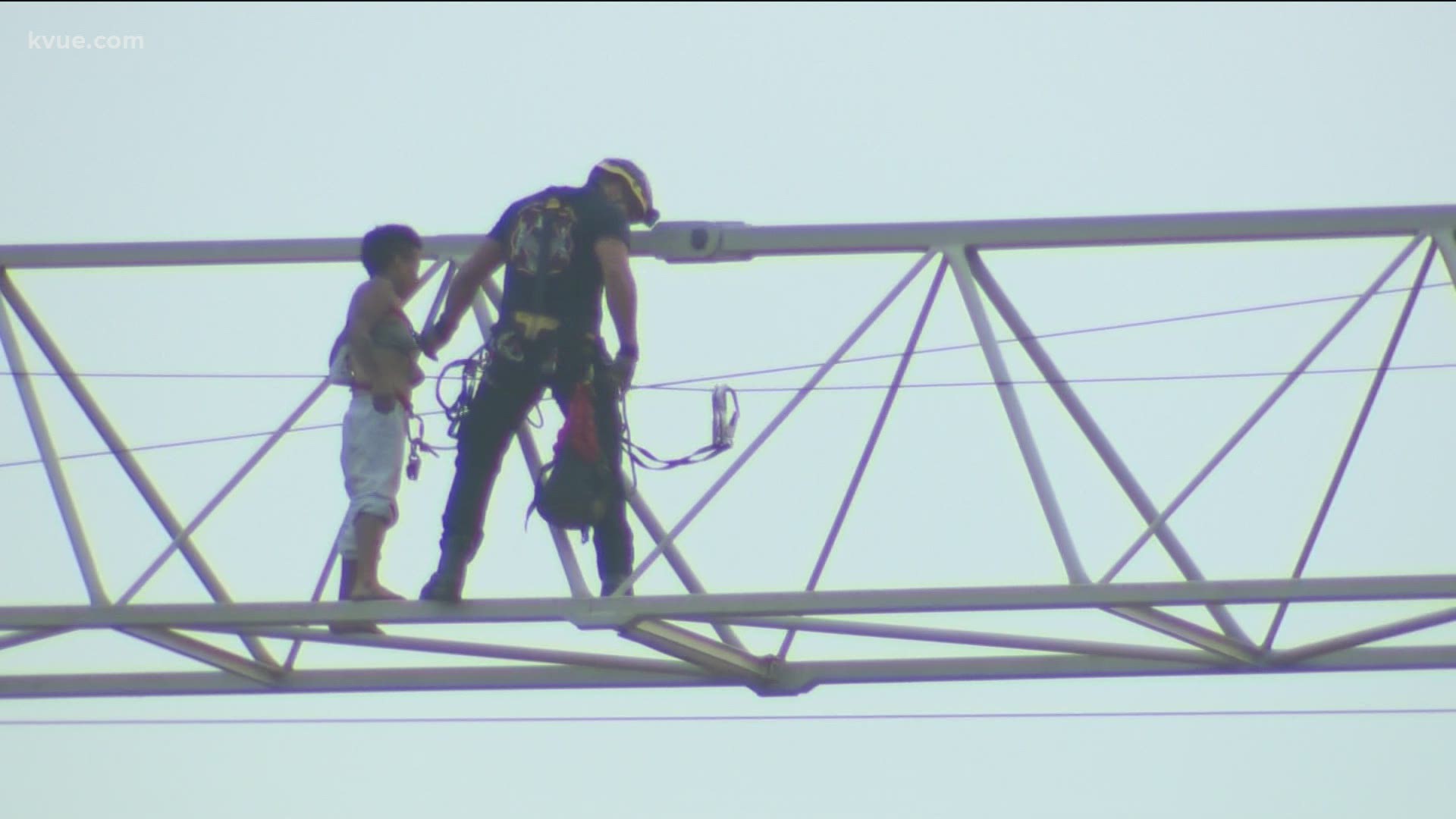 Austin-Travis County EMS and the Austin Fire Department helped get a woman stuck on the top of a crane down Monday morning.