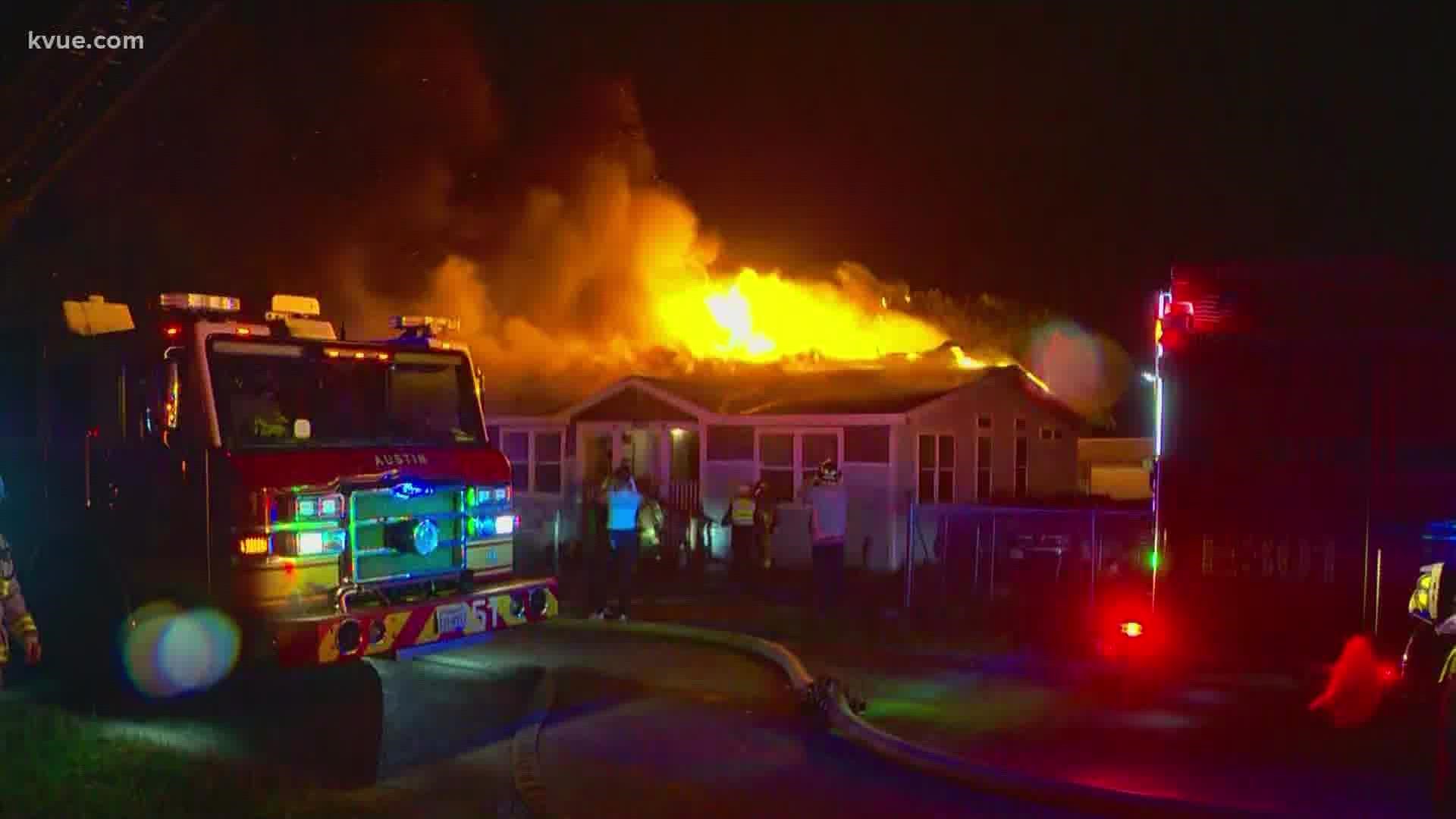 Austin firefighters helped put out an early morning fire that nearly fully-engulfed an Oak Hill home on Thursday.
