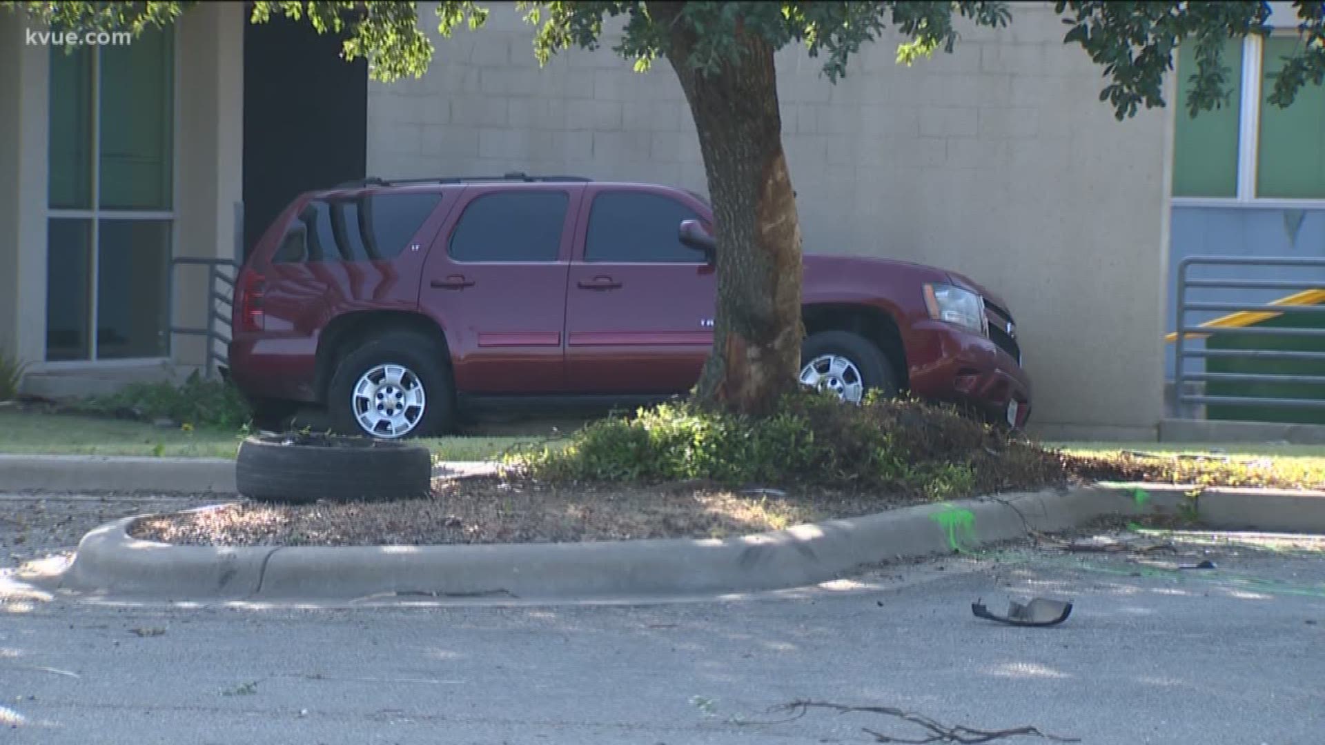 A woman is dead after the SUV she was riding in crashed into a tree near a Lower Colorado River Authority building in Austin – and police said the driver and other passengers ran off after the crash.