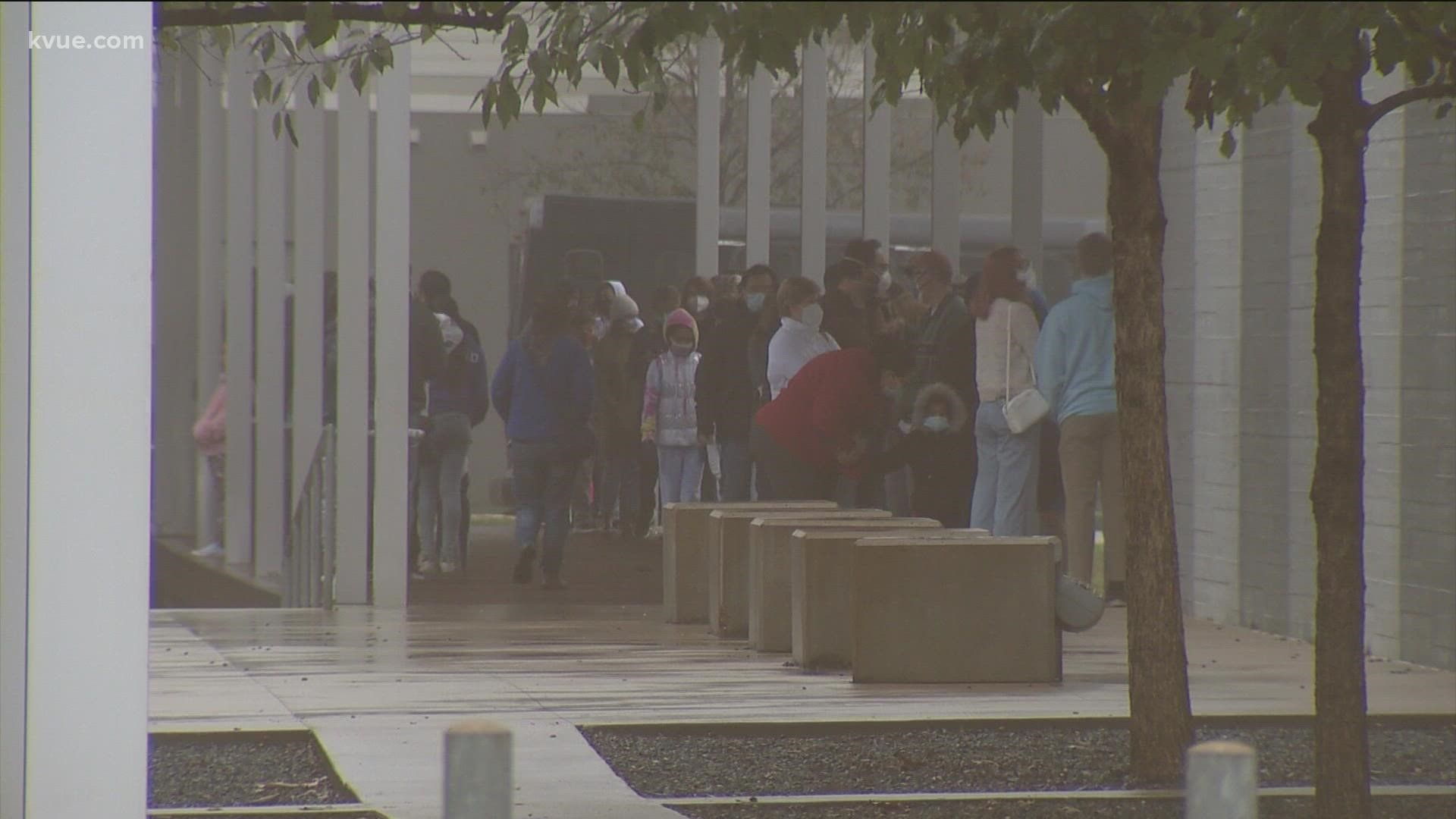 Students and community members lined up Saturday morning to get a shot or booster at the AISD Performing Arts Center.