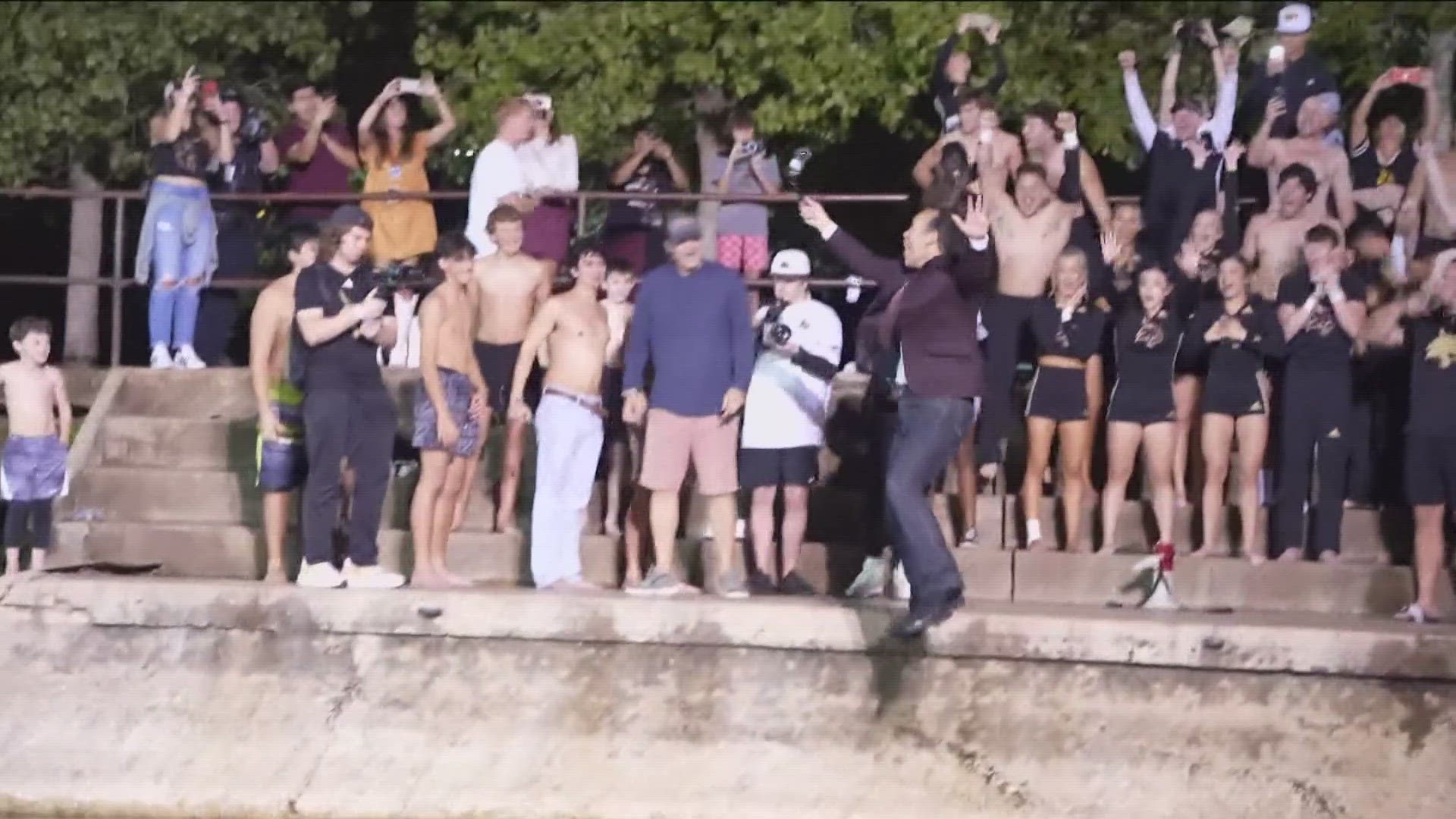 Texas State University President Kelly Damphousse and Head Coach GJ Kinne jumped into the river after the Bobcats became bowl eligible for the first time since 2014.