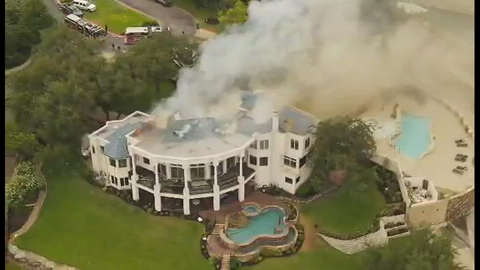 Local fire crews are working to extinguish the flames of a mansion fire off of Lake Travis. Video courtesy of Keith Verdecanna.
