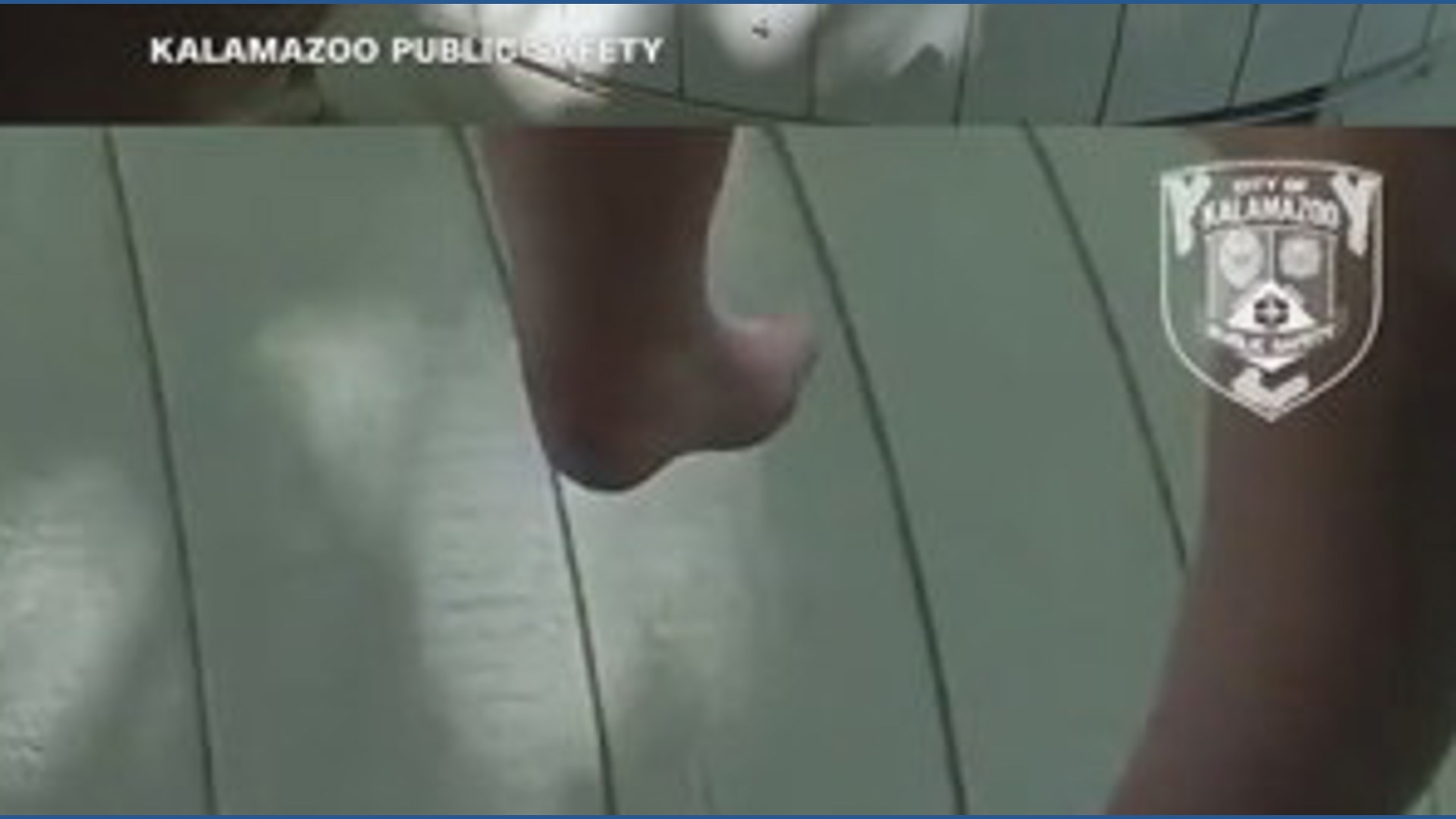 Police officer catches baby dropped from burning home in Michigan ...