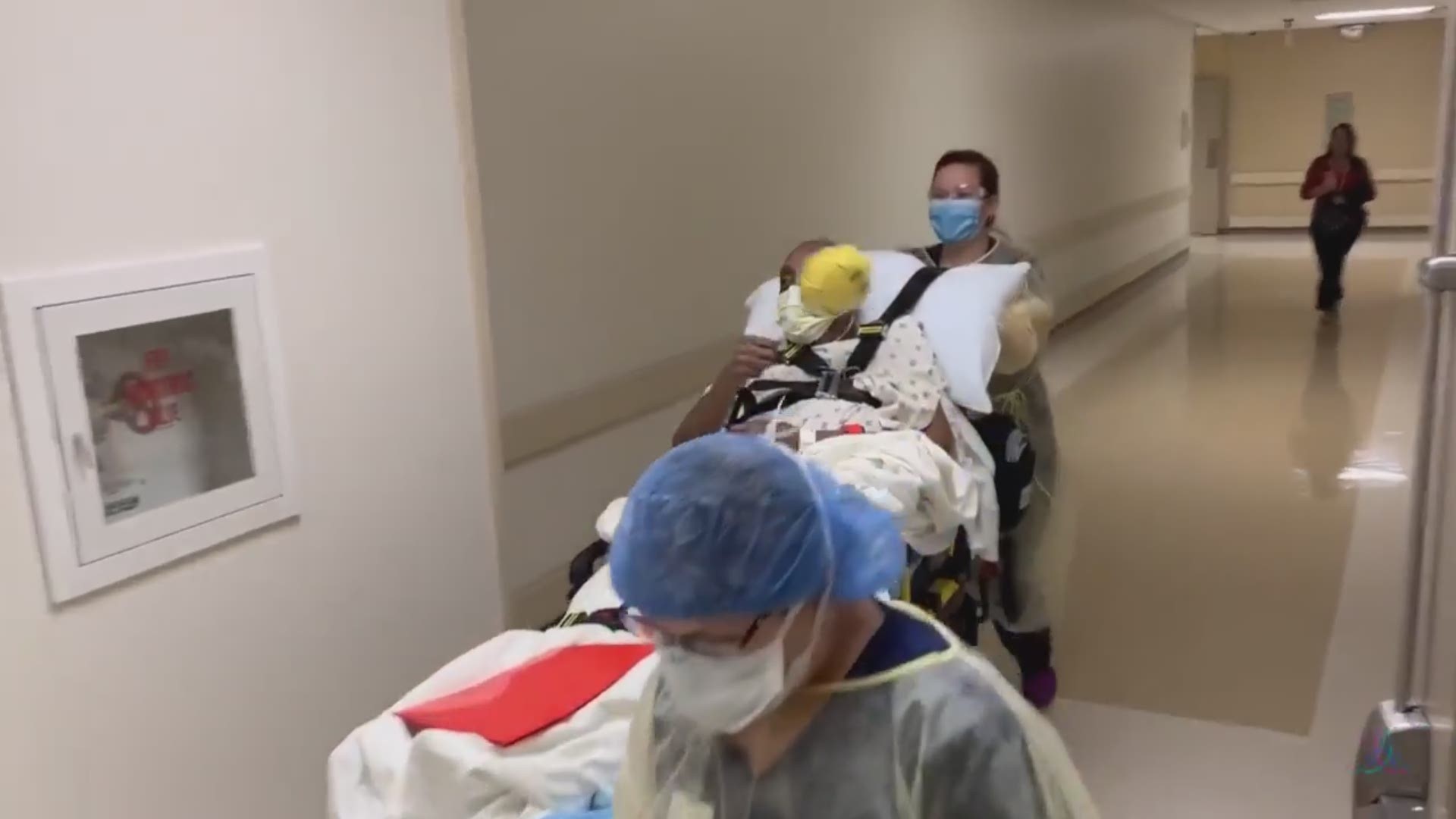 The hospital staff cheered for her on her way out