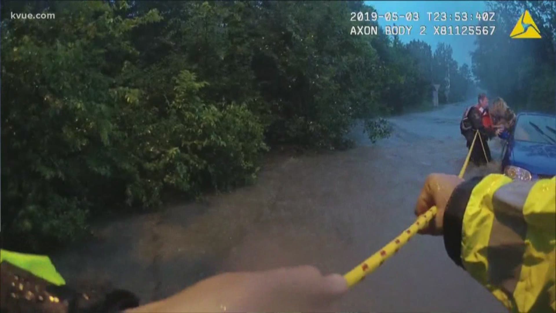 Video from the body cameras of a group of Austin police officers shows them fighting the rushing water to pull 3 people and a dog to safety.