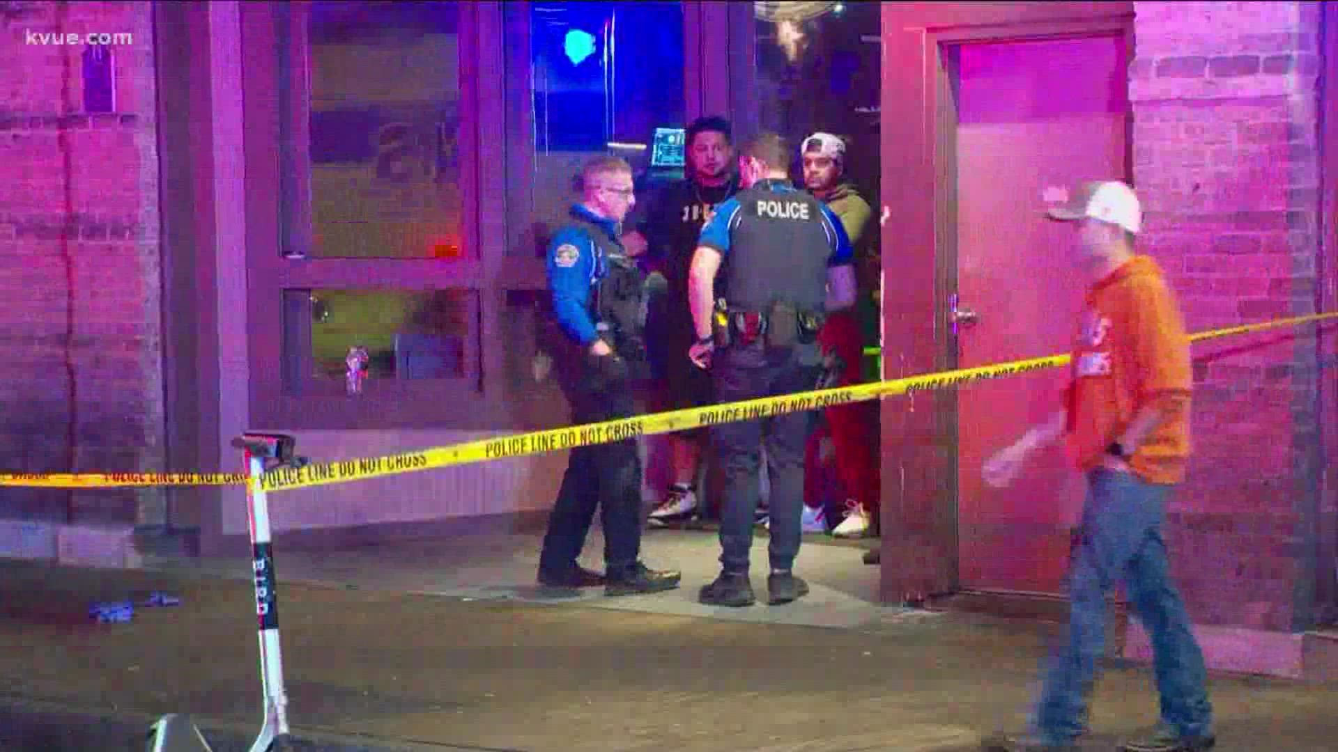 One victim is in the hospital with life-threatening injuries after a shooting inside The Lodge bar on East Sixth Street.