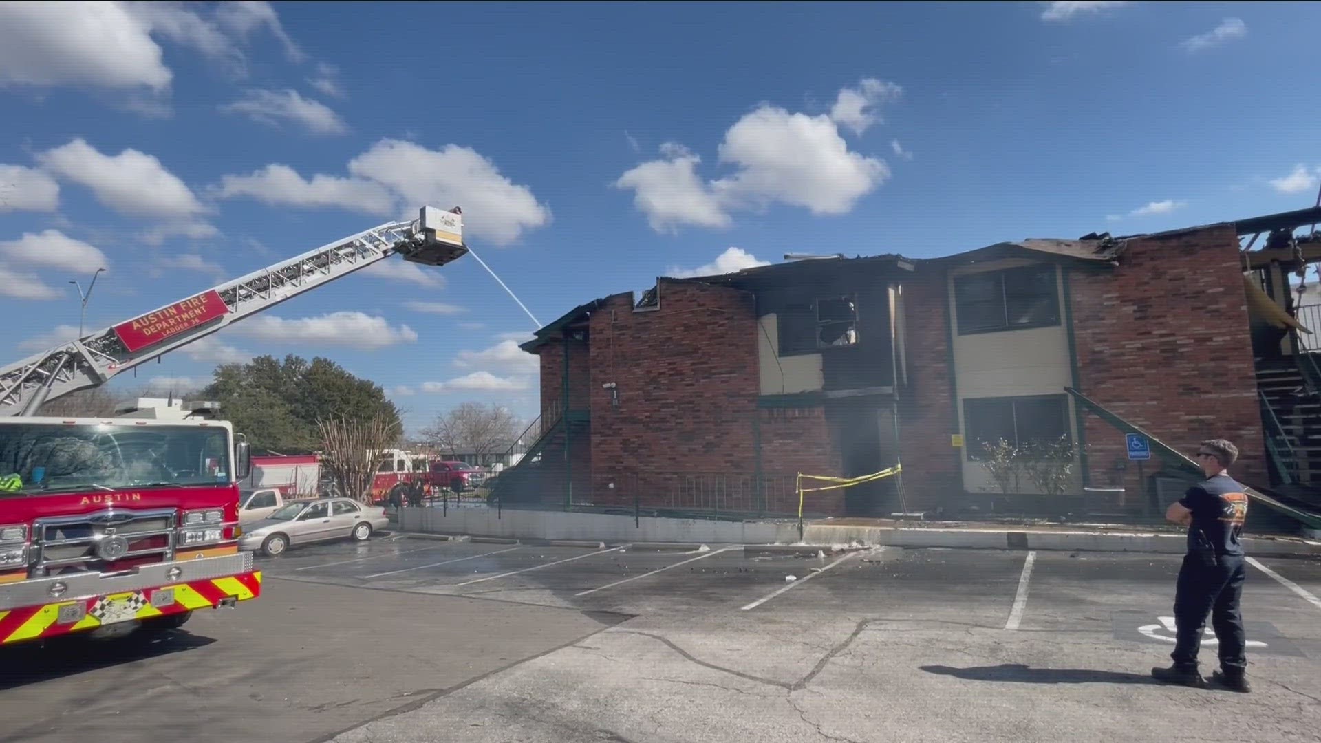 The fire originated on a corner balcony before extending to other buildings.