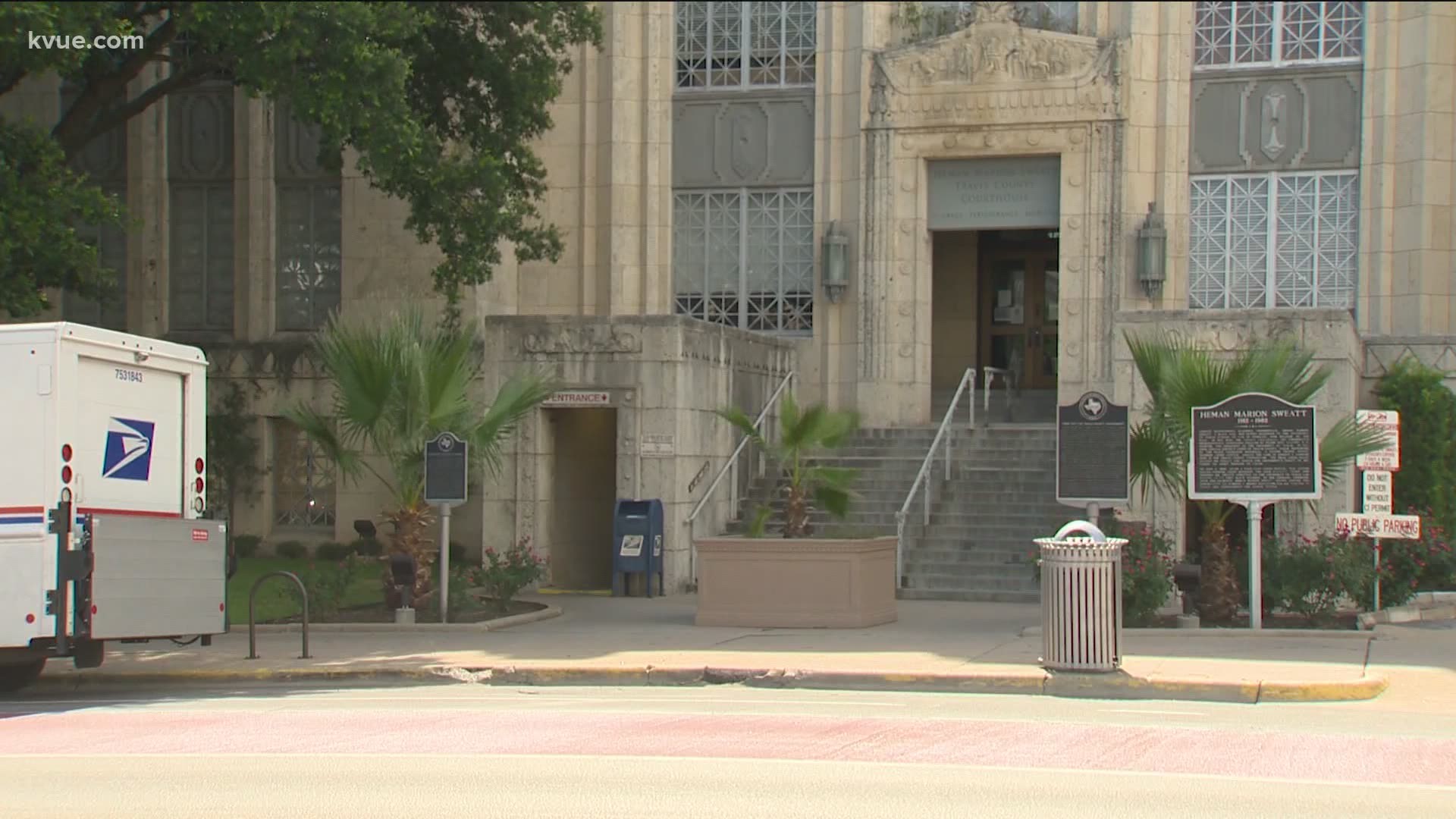 Despite rising case numbers, the Travis County Clerk's Office has dozens of employees back working in the office.