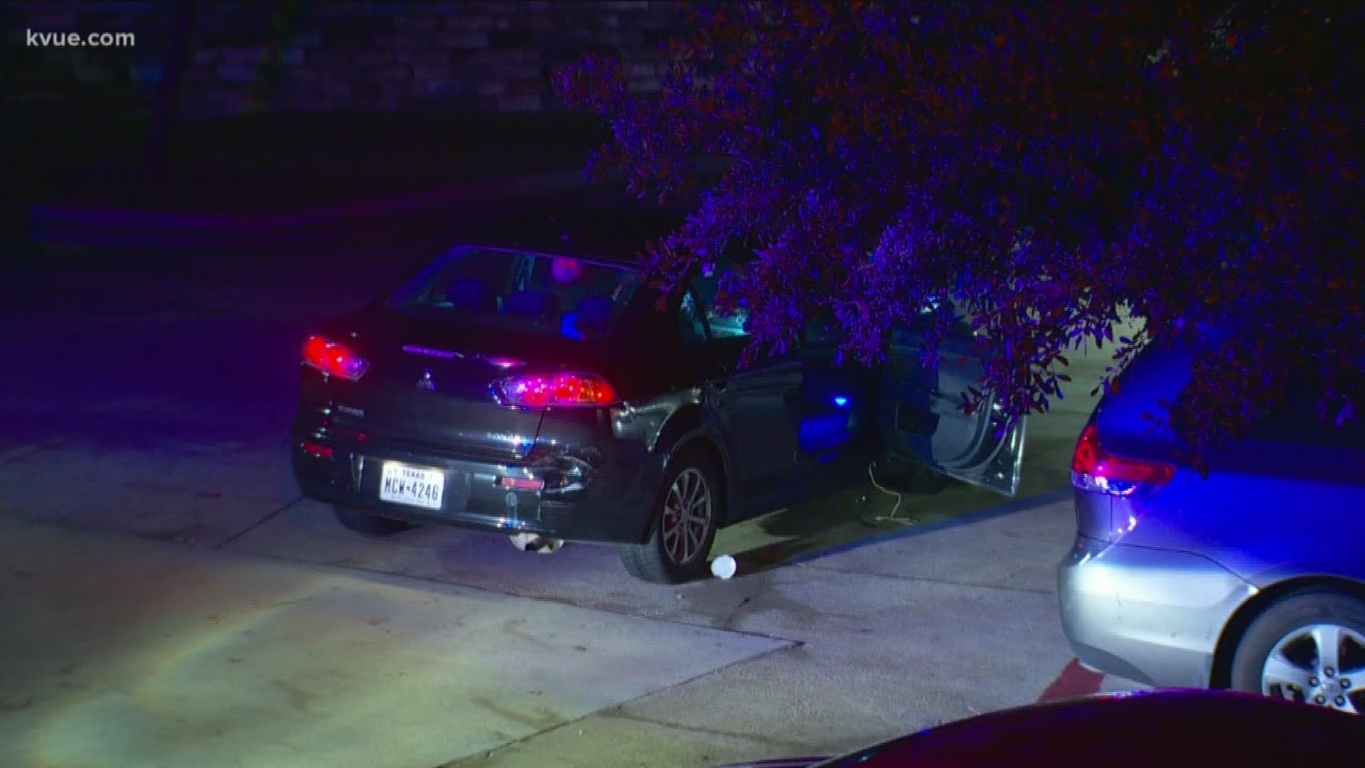 A car covered in bullet holes was found at the scene at the apartment complex.