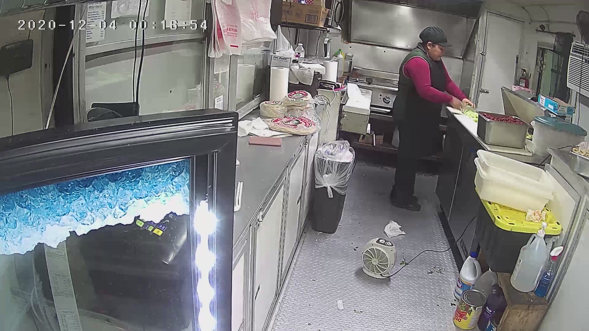 In a surveillance video time-stamped Dec. 4, a man was seen entering a food truck and holding a gun to the employees while he robbed them.