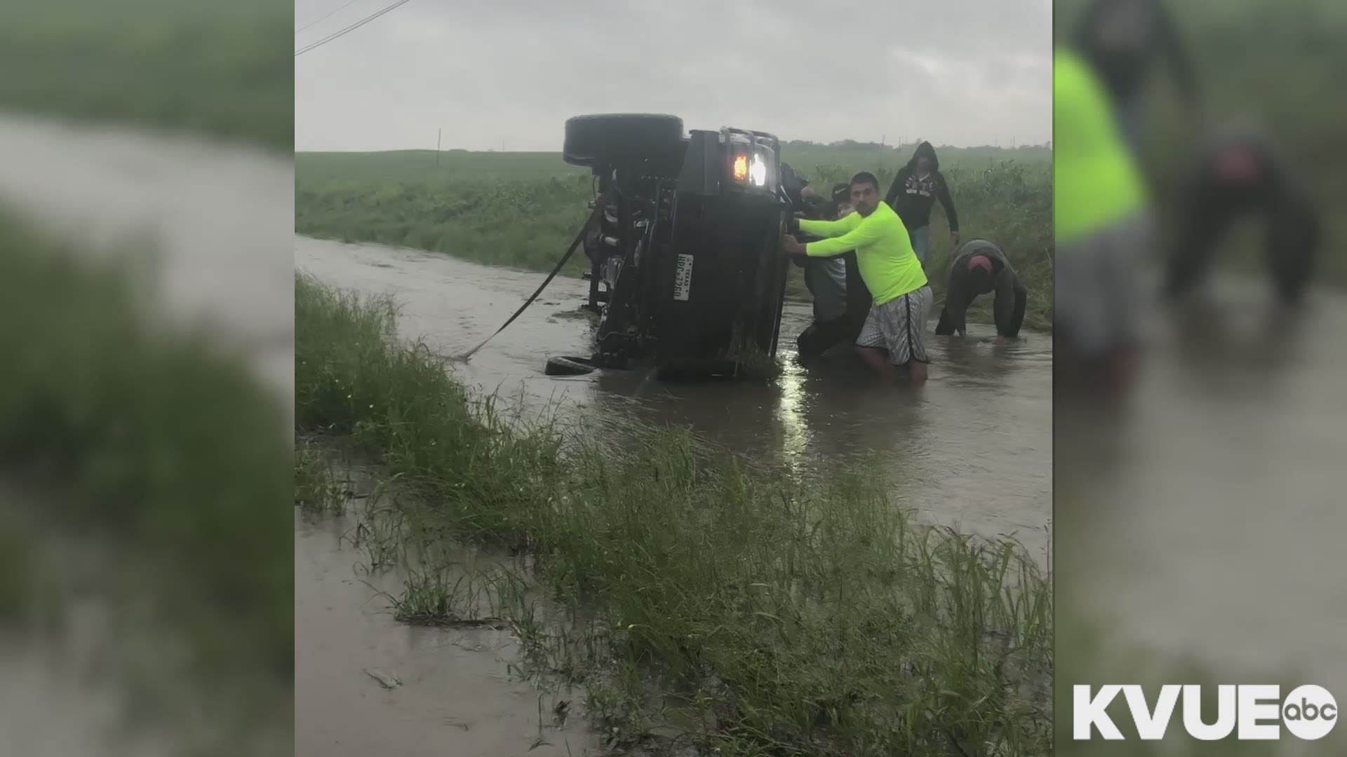 One woman said she saw a splash. Then, people got into the water to help flip the truck over.