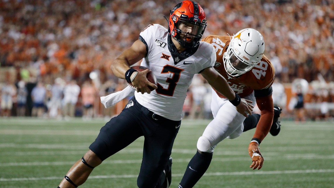 Oklahoma State's Spencer Sanders connects with Jelani Woods for 34