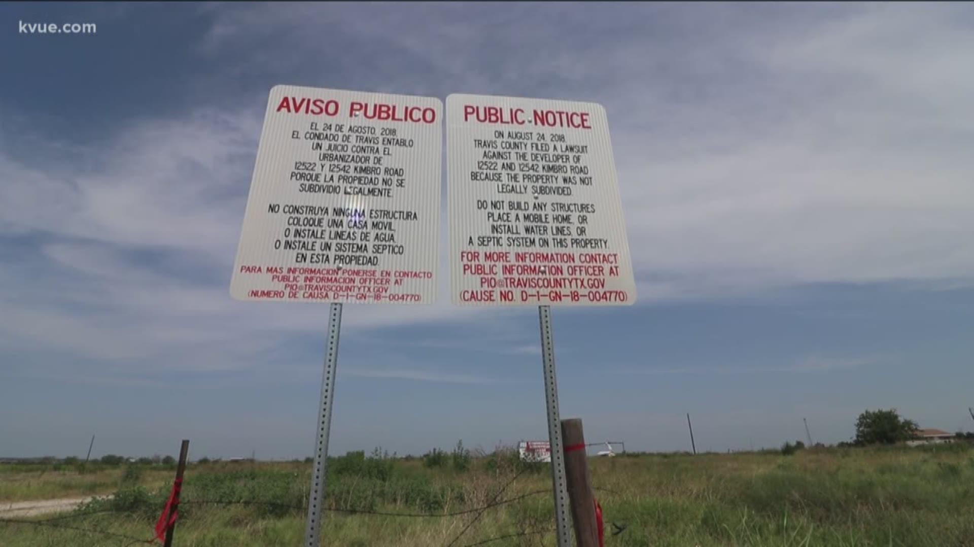 A neighborhood Travis County says is "not legally subdivided" now has a sign warning people not to buy there.