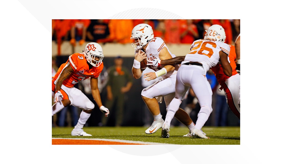 Texas wide receiver Lil'Jordan Humphrey, left, celebrates after scoring a  touchdown on a 15-yard reception with teammate John Burt (1) against  Oklahoma during the second half of an NCAA college fo …