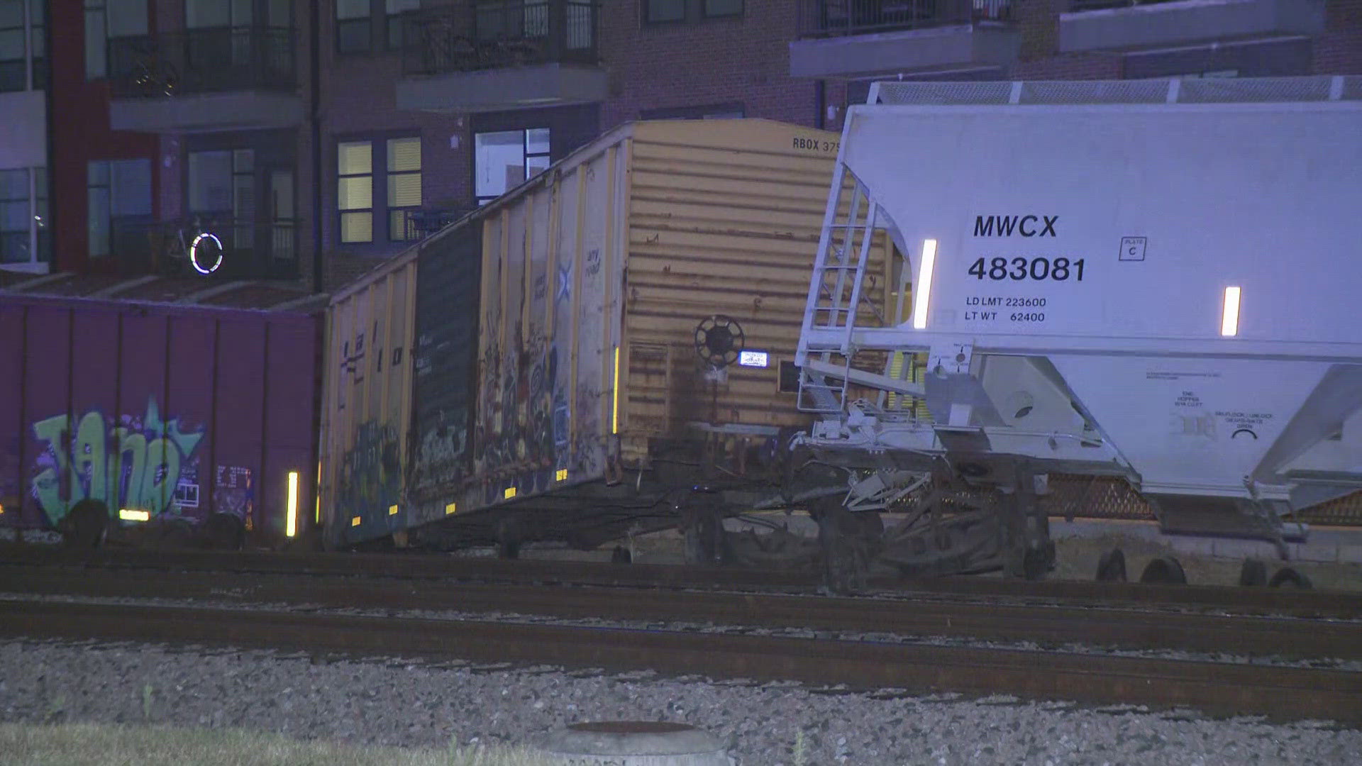 Seven train cars fell off the tracks after crashing into a utility pole near Sixth Street and Pedernales Street, according to responders.