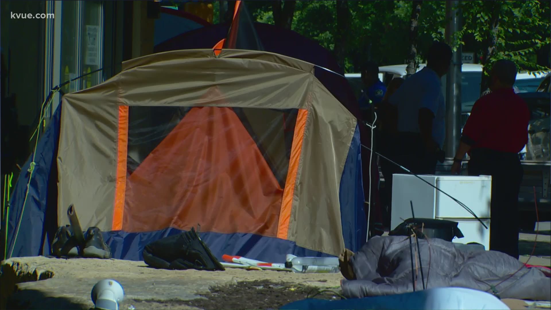 A KVUE photographer saw crews with the city and police cleaning up and throwing away tents outside Austin City Hall.