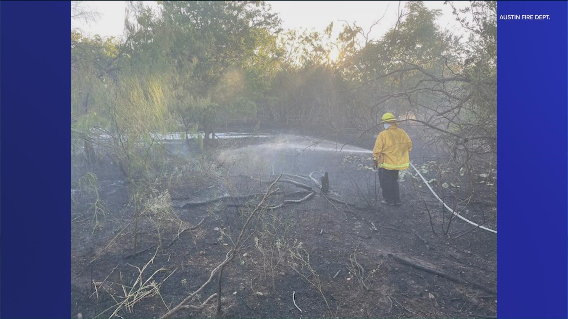 Crews in South Austin tackled a fire that spread to some propane tanks in a camp in the woods.