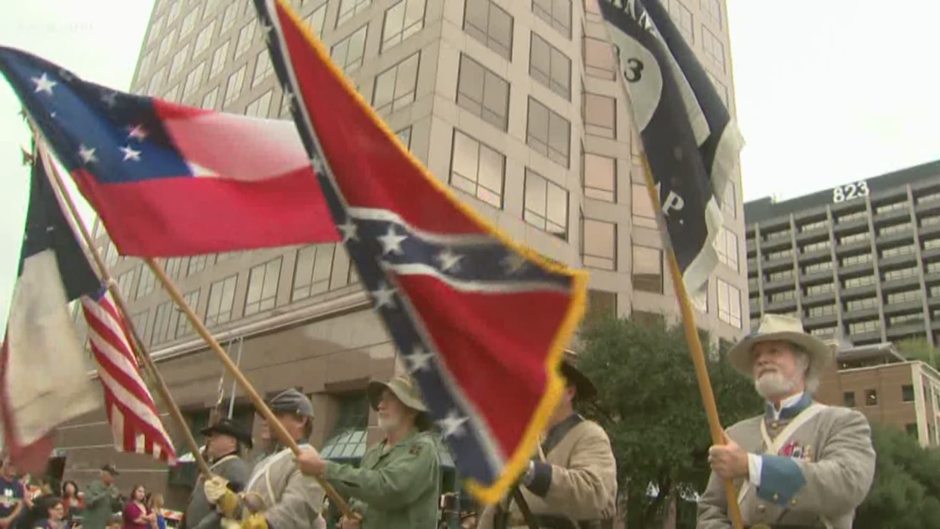 Austin's mayor is at odds with two groups participating in this year's Veterans Day parade over the Confederate flag.