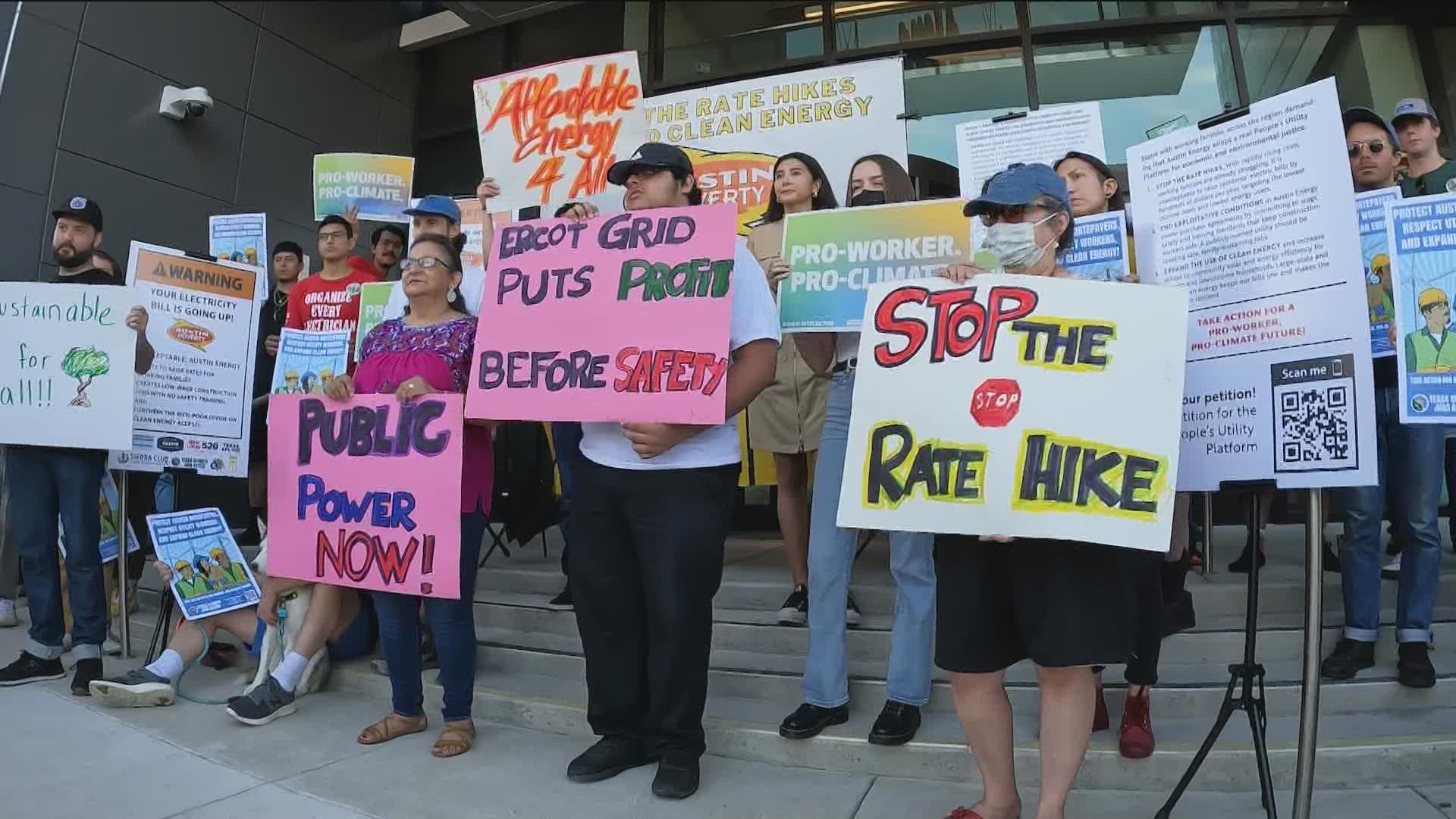 Residents and groups gathered outside the Austin Energy headquarters on Saturday to call for change.