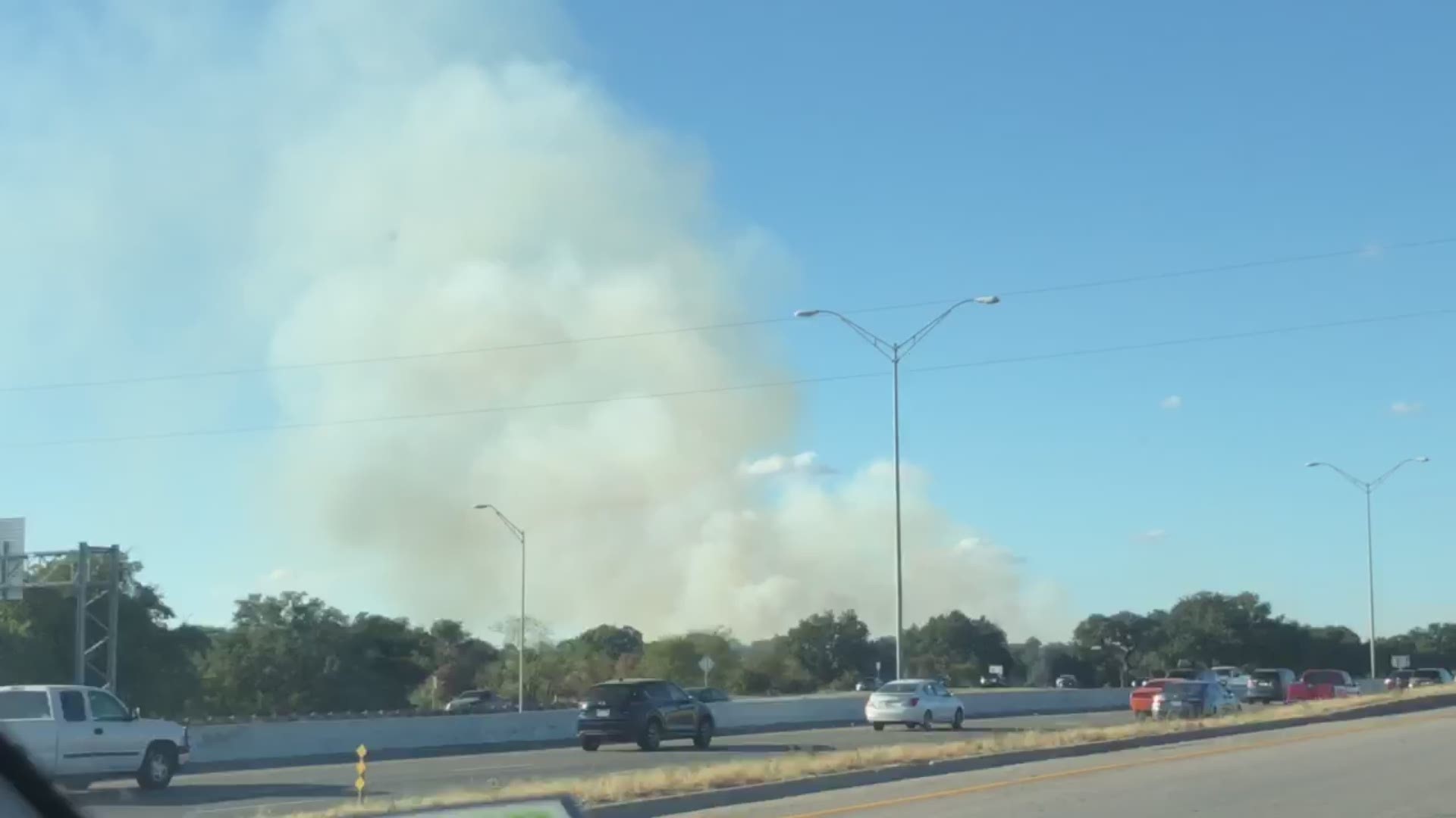 The fire is burning around three acres off of Interstate Highway 35.