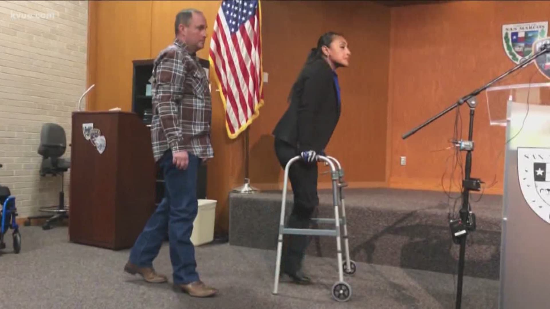 A San Marcos police officer who had to crawl onto I-35 after being hit by an accused drunk driver is now standing tall.