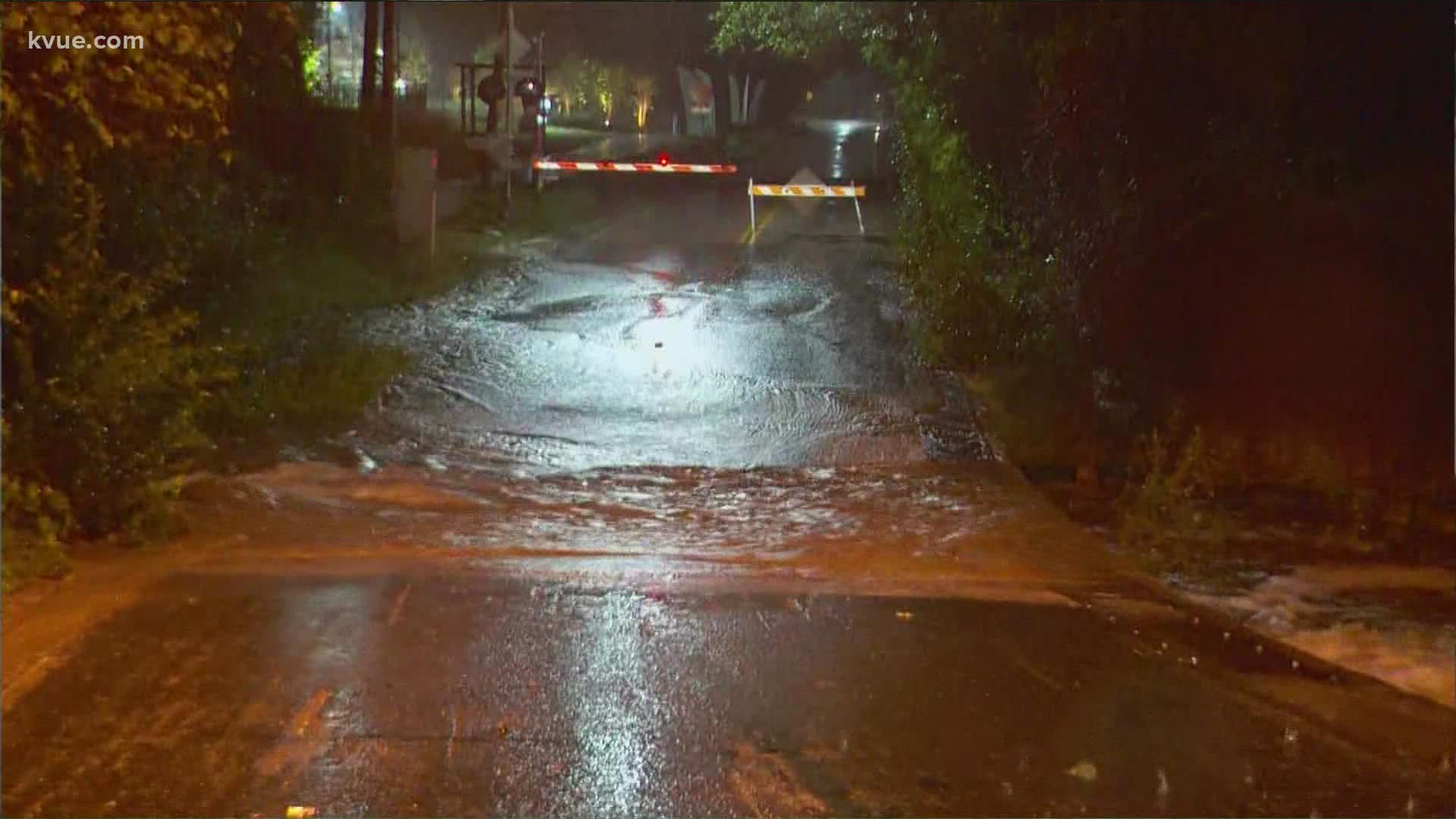 Flooding from tropical rain in Central Texas forced roadways to close and many schools to delay classes.