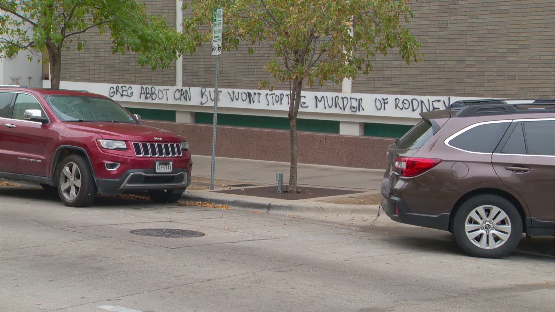 The spray-painted message says, 'Greg Abbott can but won't stop the murder of Rodney Reed.'