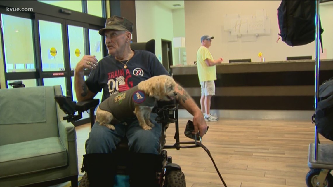 Cyclists passing through Austin Saturday are raising money for service dogs for veterans.