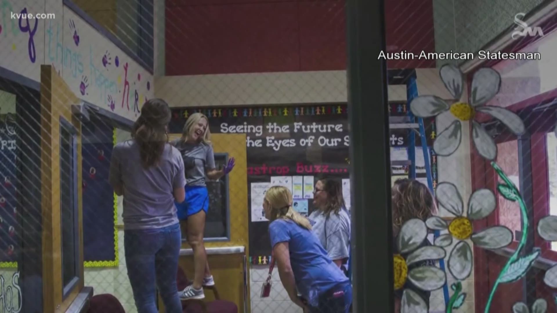 Positive messages painted on bathroom walls at Leander school