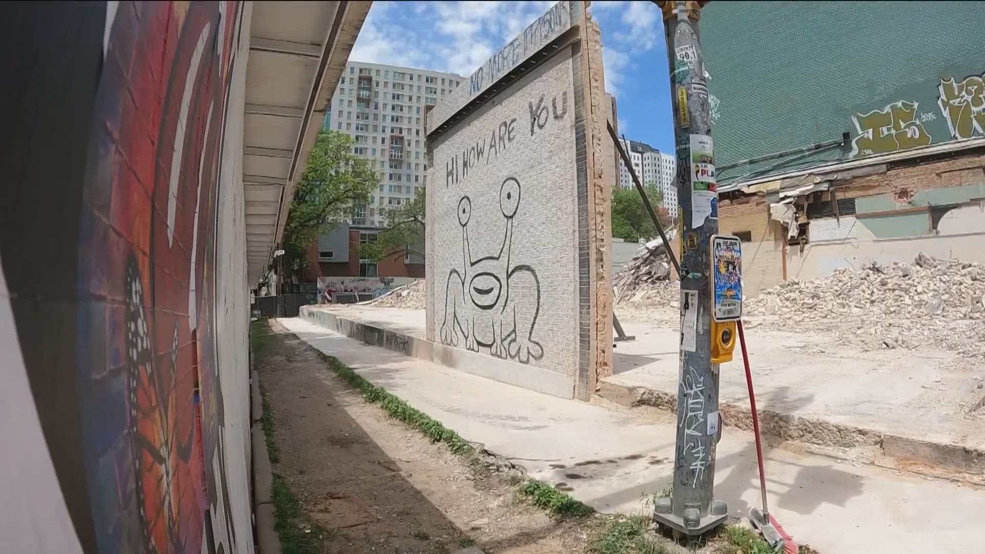Bulldozers knocked down a building that featured one of Austin's most famous murals. But the art is still standing on the corner of Guadalupe and 21st streets.