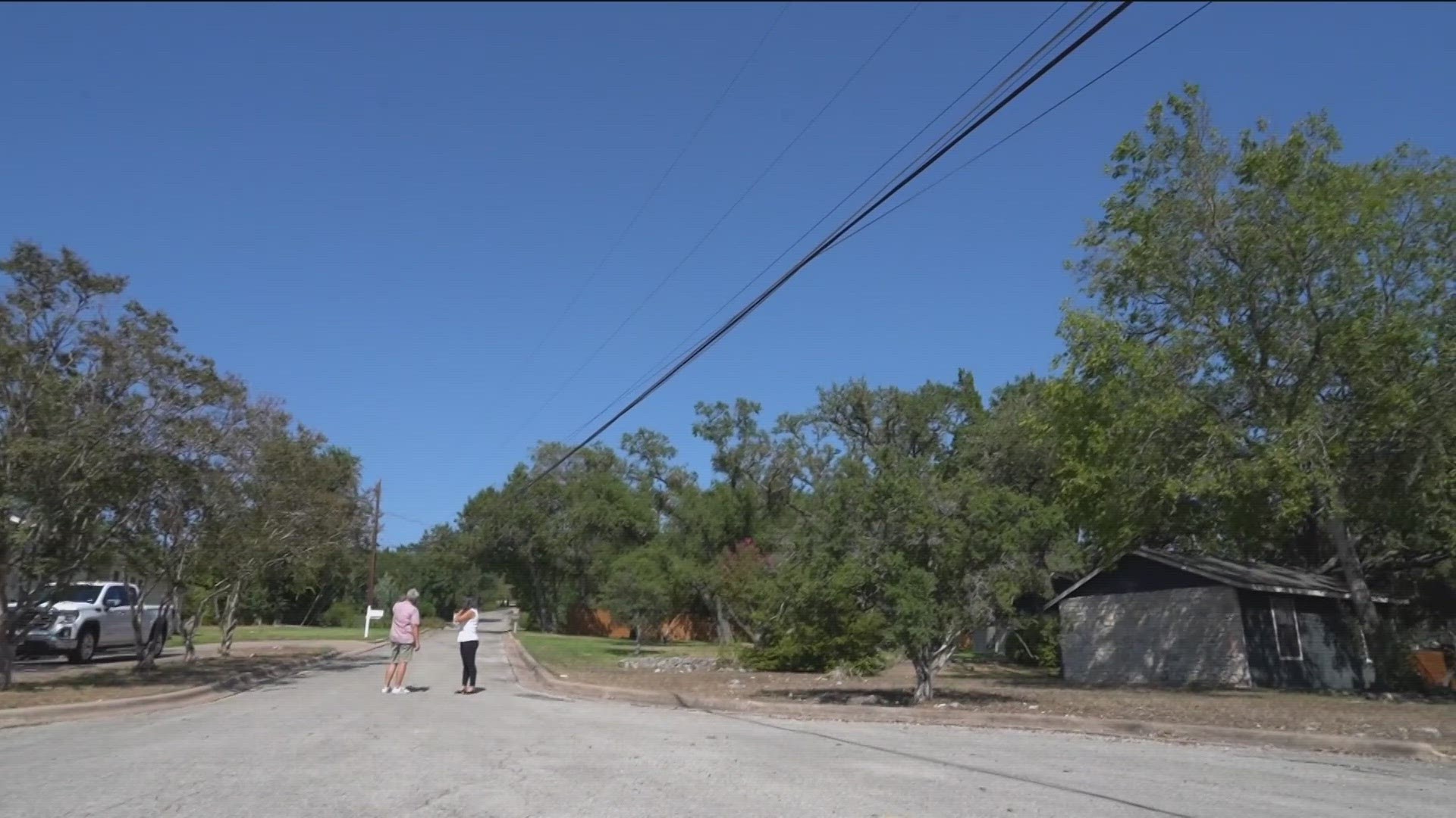 Low-hanging wires forced trash pickup crews to steer clear of some homes in West Austin.