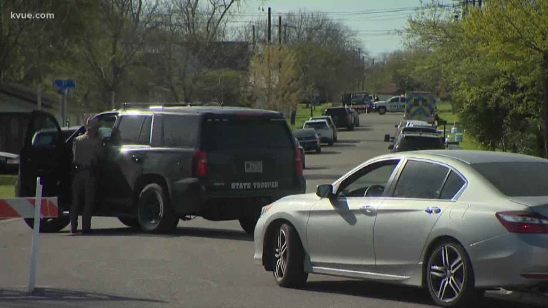 Authorities have blocked off a perimeter around the suspected Austin bomber's home as they continue to search for a motive and investigate whether anyone else may have been involved.