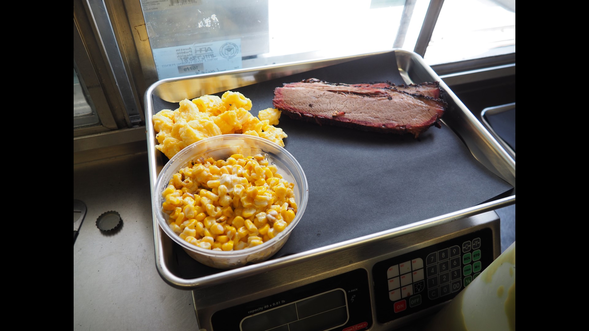 Louie's Craft BBQ serves loaded baked potatoes the size of your head